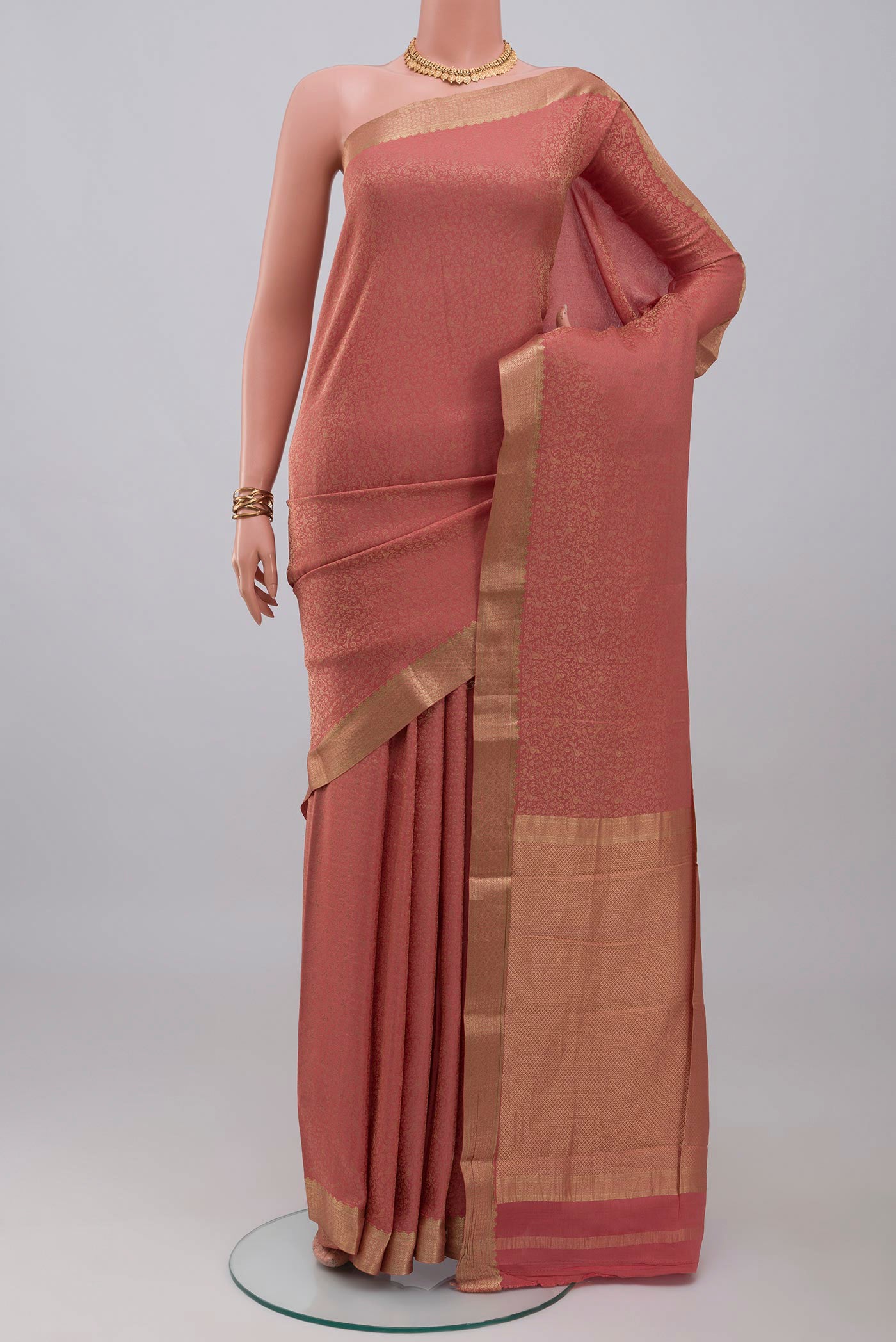 Rose Gold Mysore Crepe Saree with Zari Brocade on the body and Zari Border.  displayed on a mannequin