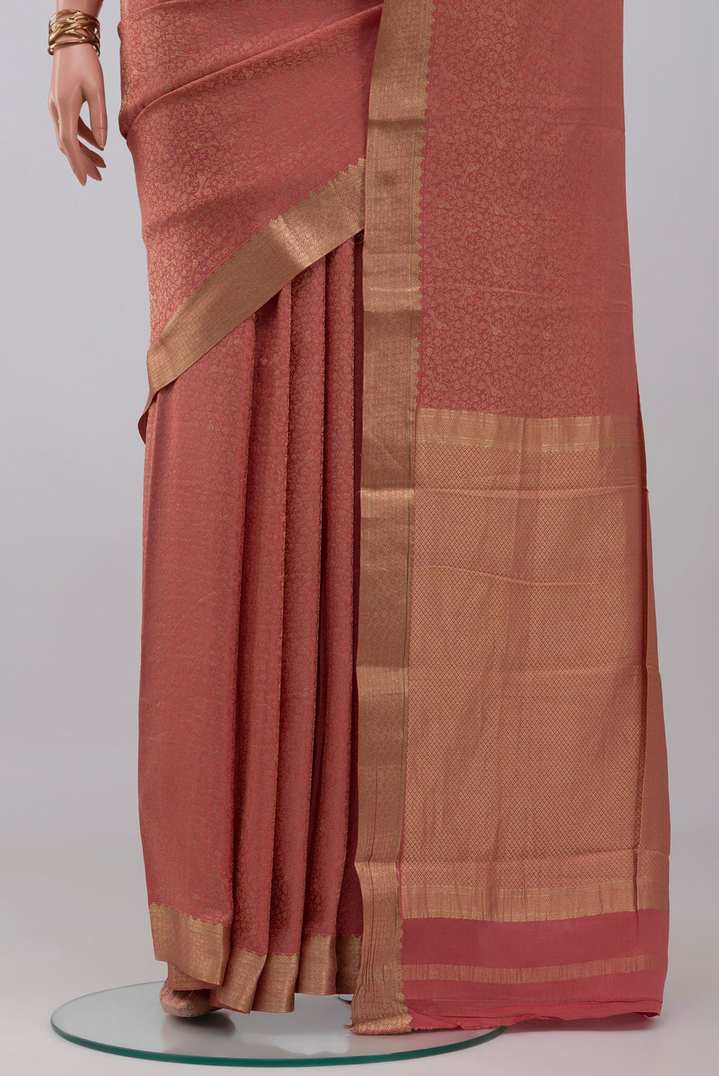 Pleats and pallu of Rose Gold Mysore Crepe Saree with Zari Brocade on the body and Zari Border. 