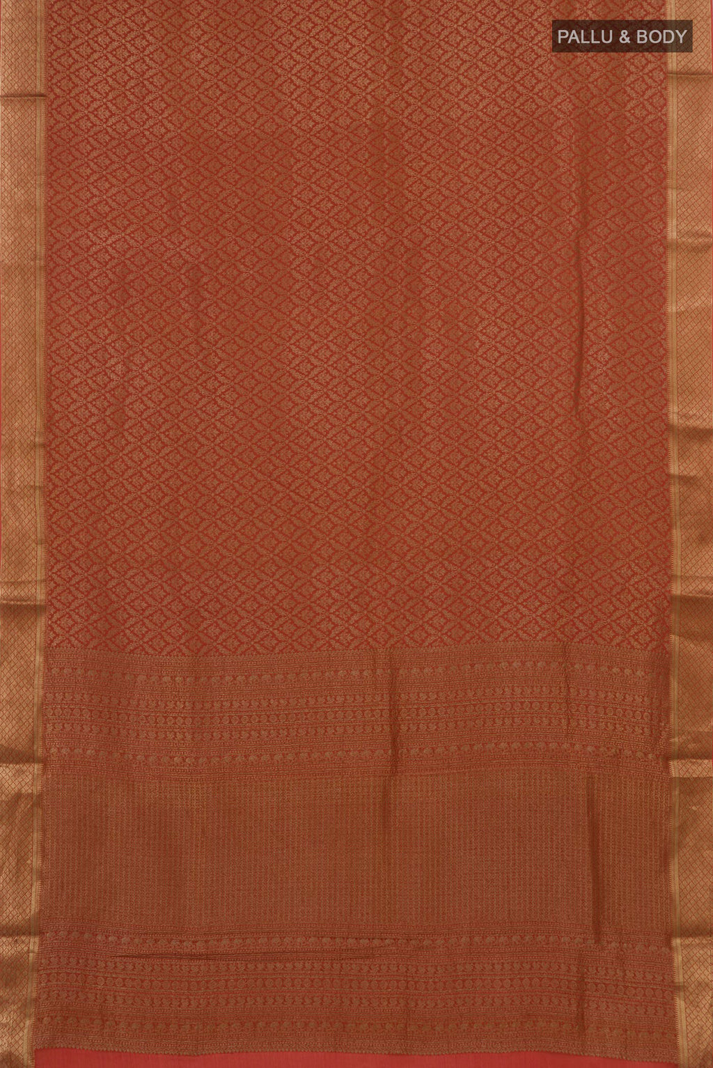 Flat view of Rust Mysore Crepe Saree with Zari Brocade on the body and Zari Border. 