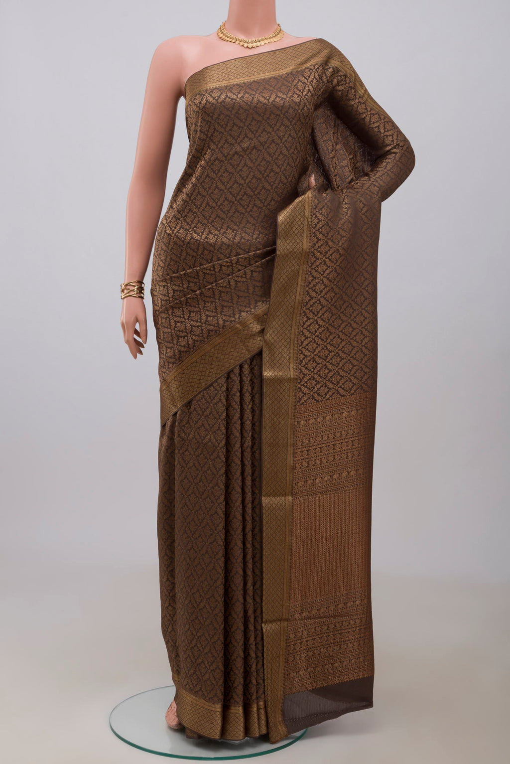 Brown Mysore Crepe Saree with Zari Brocade on the body and Zari Border.  displayed on a mannequin