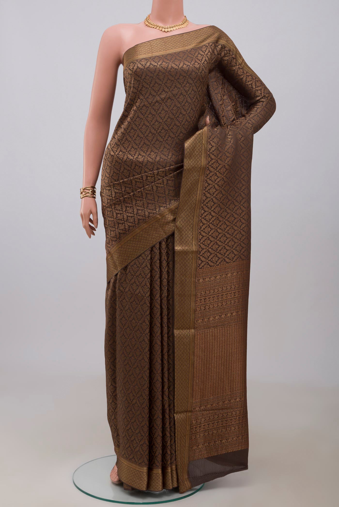 Brown Mysore Crepe Saree with Zari Brocade on the body and Zari Border.  displayed on a mannequin