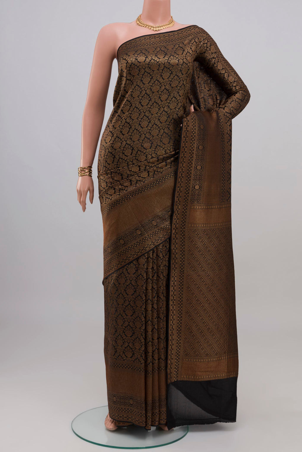 Black Mysore Crepe Saree with Zari Brocade on the body and Fancy Border.  displayed on a mannequin