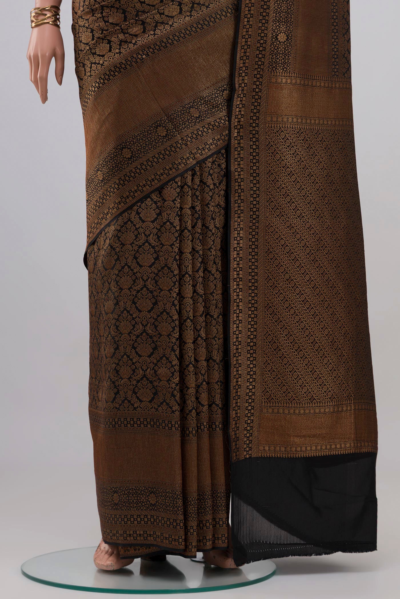 Pleats and pallu of Black Mysore Crepe Saree with Zari Brocade on the body and Fancy Border. 