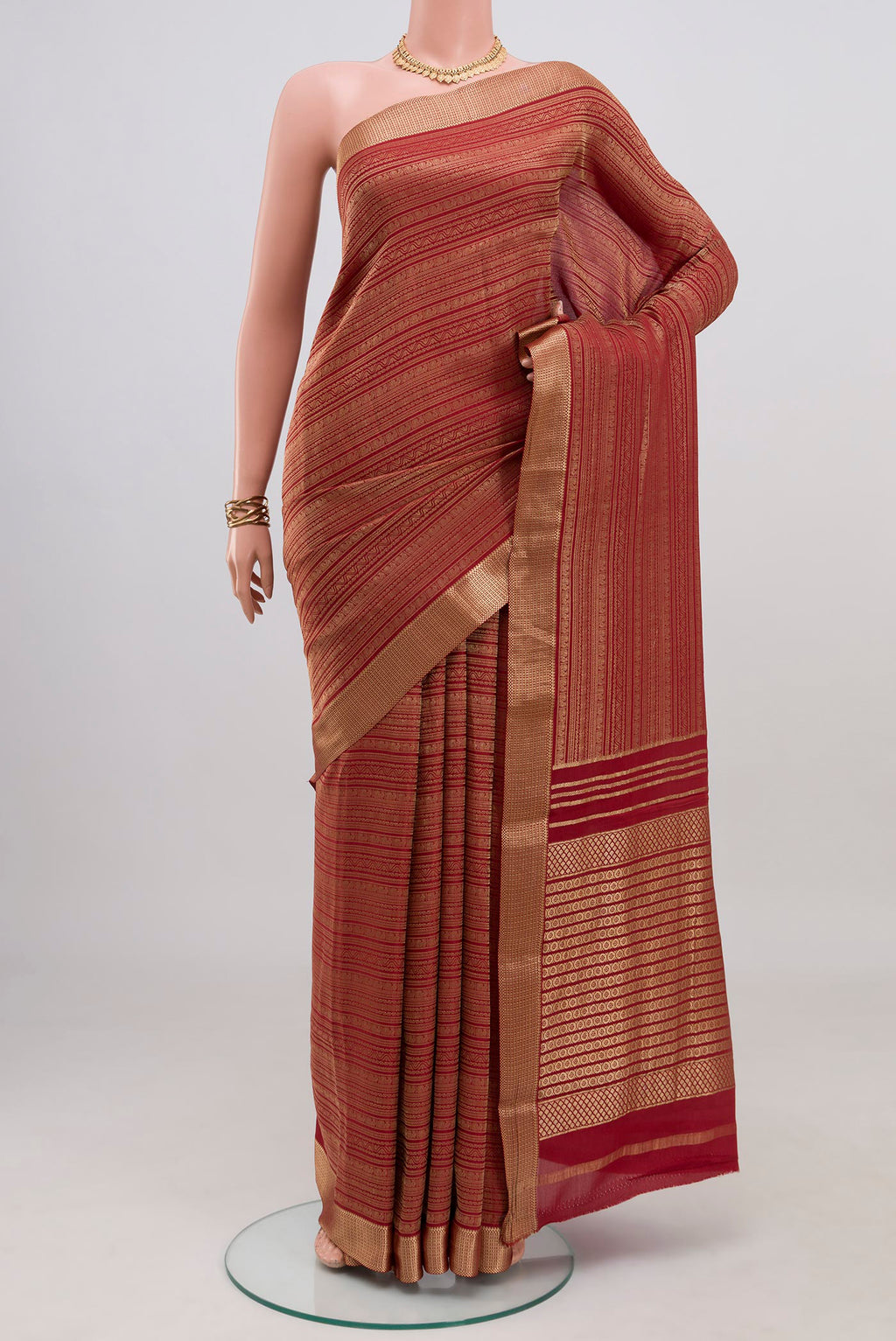 Maroon Mysore Crepe Saree with Zari Brocade on the body and Zari Border.  displayed on a mannequin