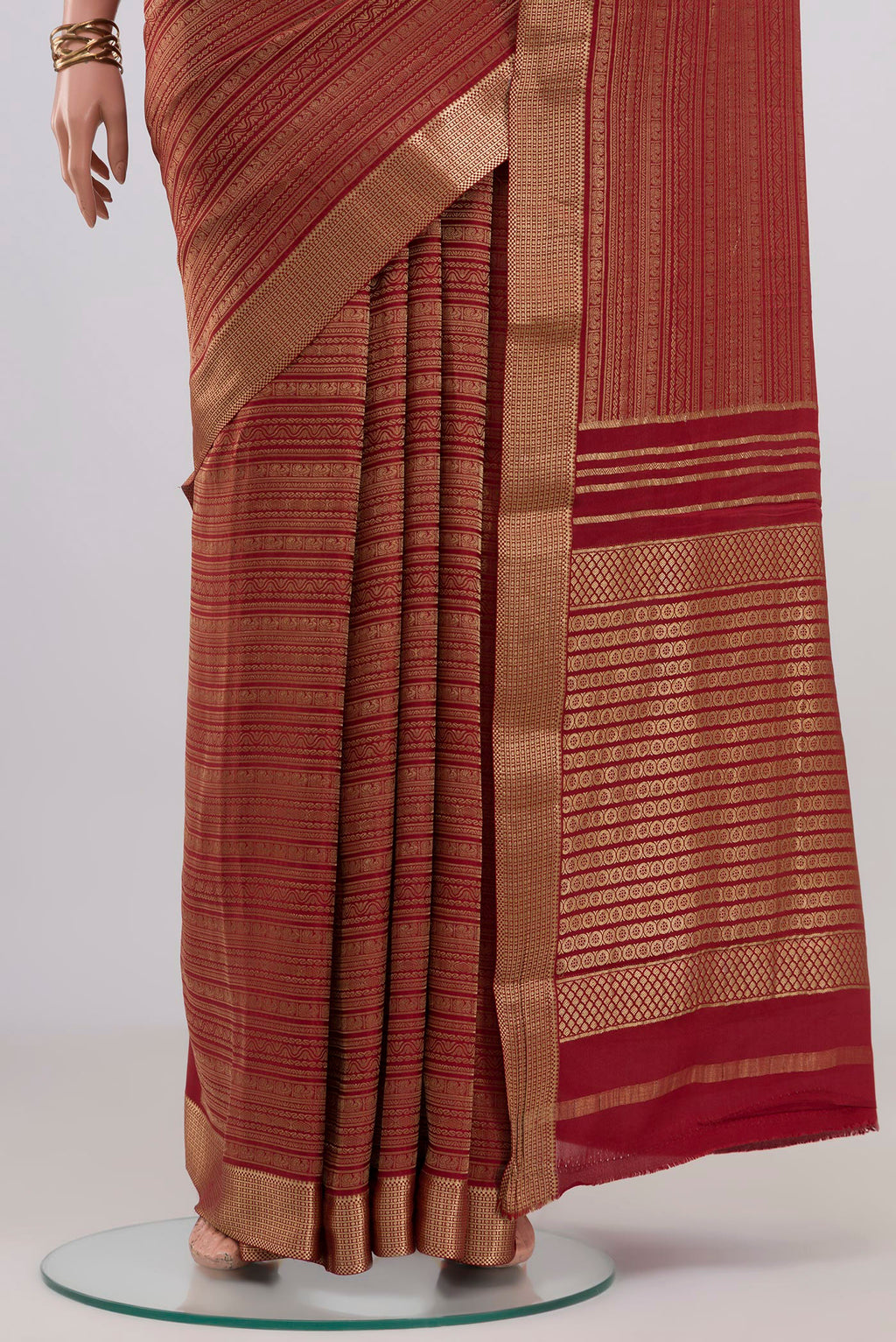 Pleats and pallu of Maroon Mysore Crepe Saree with Zari Brocade on the body and Zari Border. 