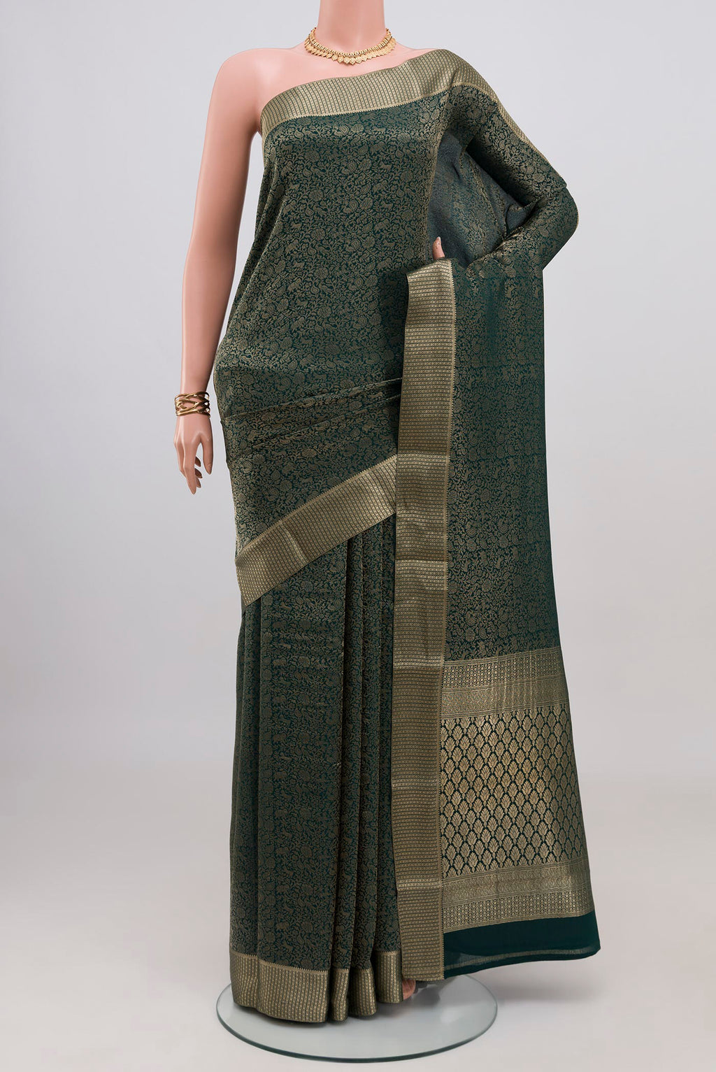 Bottle Green Mysore Crepe Saree with Zari Brocade on the body and Zari Border.  displayed on a mannequin