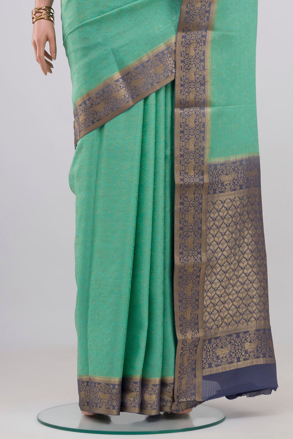 Pleats and pallu of Sea Green Mysore Crepe Saree with Zari Brocade on the body and Zari Border. 