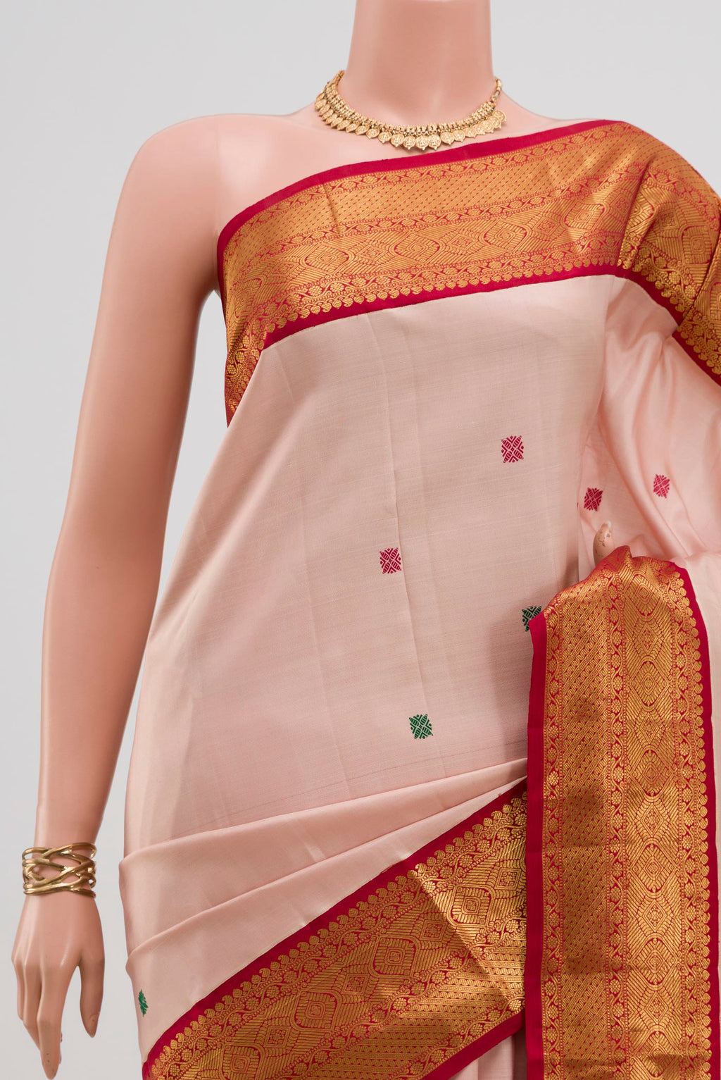 Border image of Pure Silk Pure Zari Peach Kanjivaram Saree with Thread Butta on the body and Zari Border. 