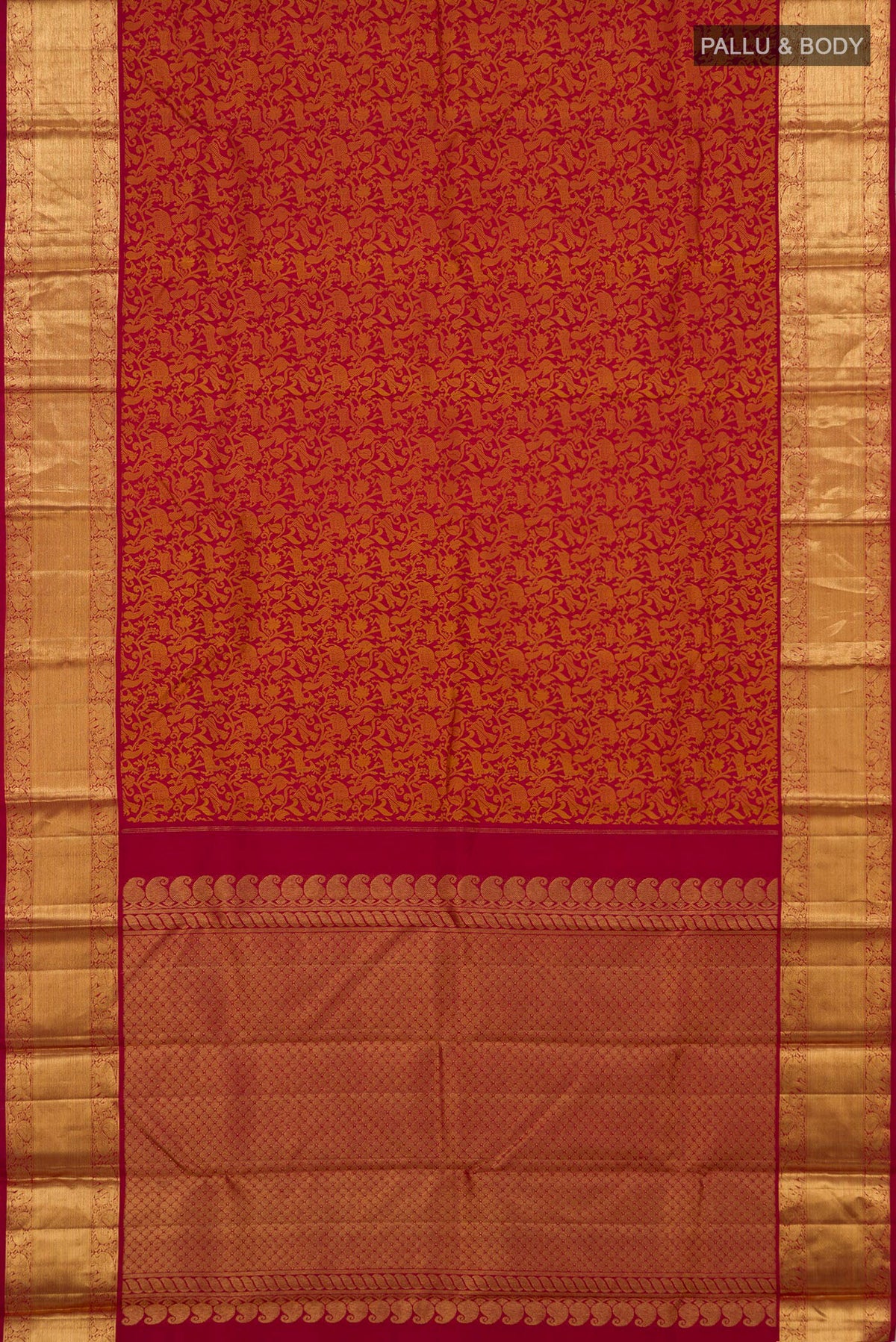 Flat view of Red Kanjivaram Silk Saree with Jacquard design on the body and Zari Border. 