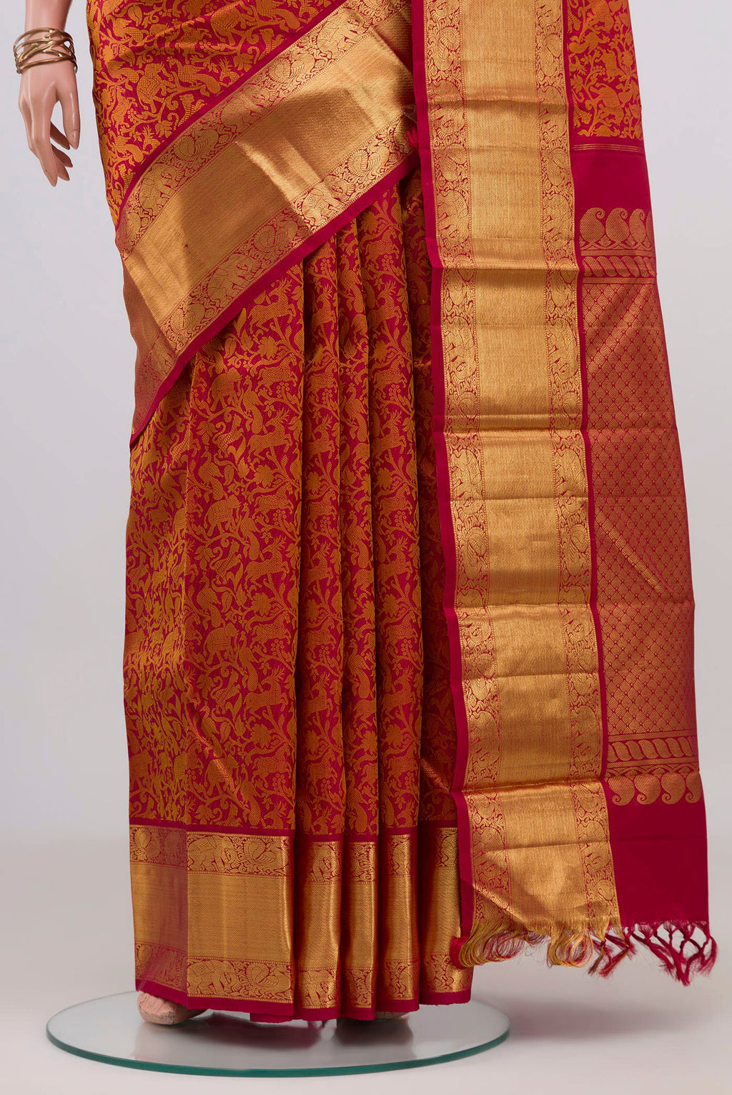 Pleats and pallu of Red Kanjivaram Silk Saree with Jacquard design on the body and Zari Border. 