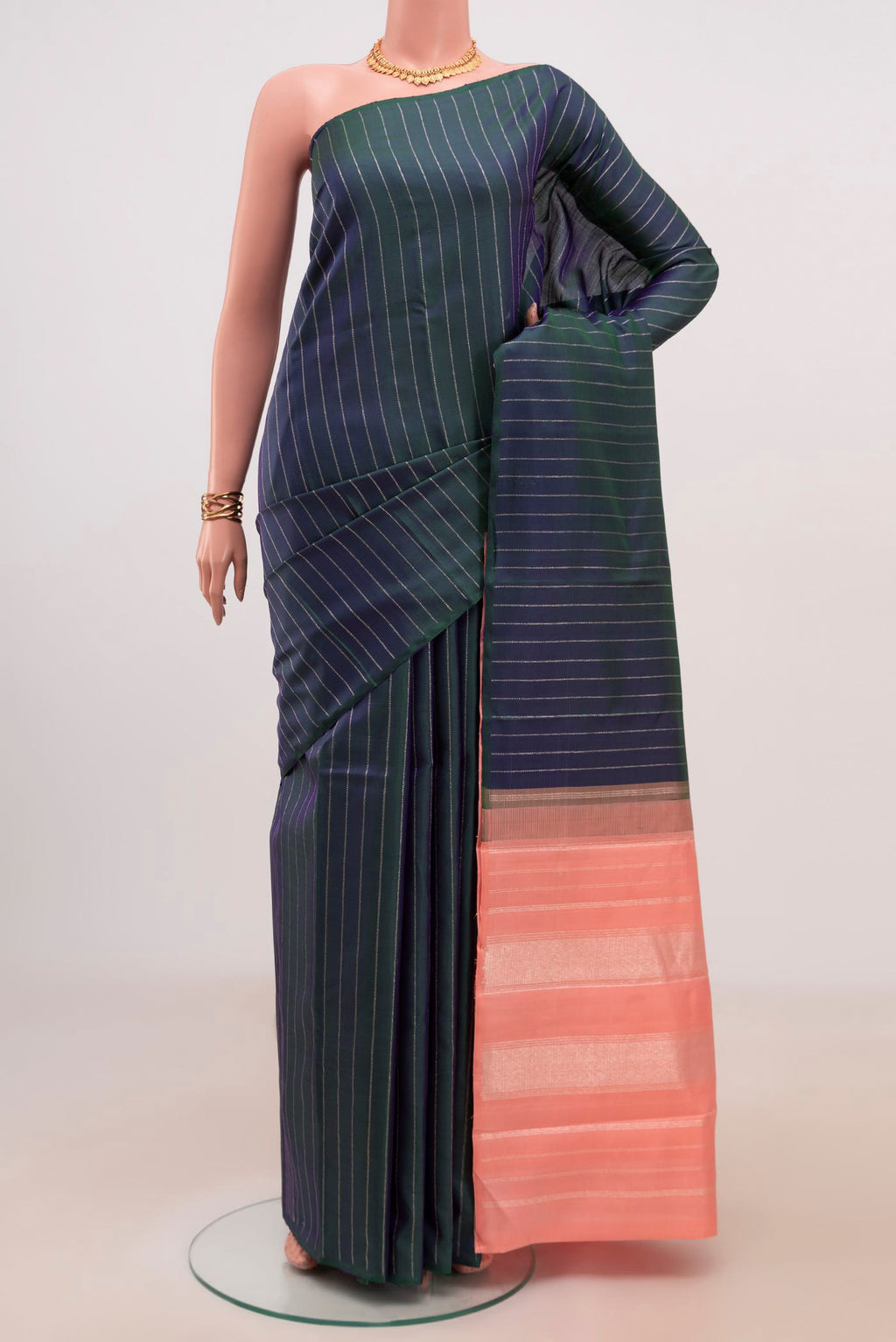 Peacock Blue Kanjivaram Silk Saree with Stripes on the body and Without Border.  displayed on a mannequin