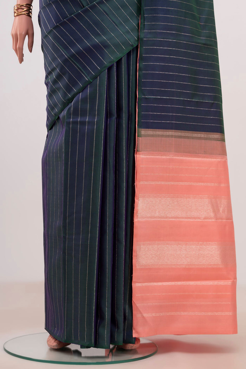 Pleats and pallu of Peacock Blue Kanjivaram Silk Saree with Stripes on the body and Without Border. 
