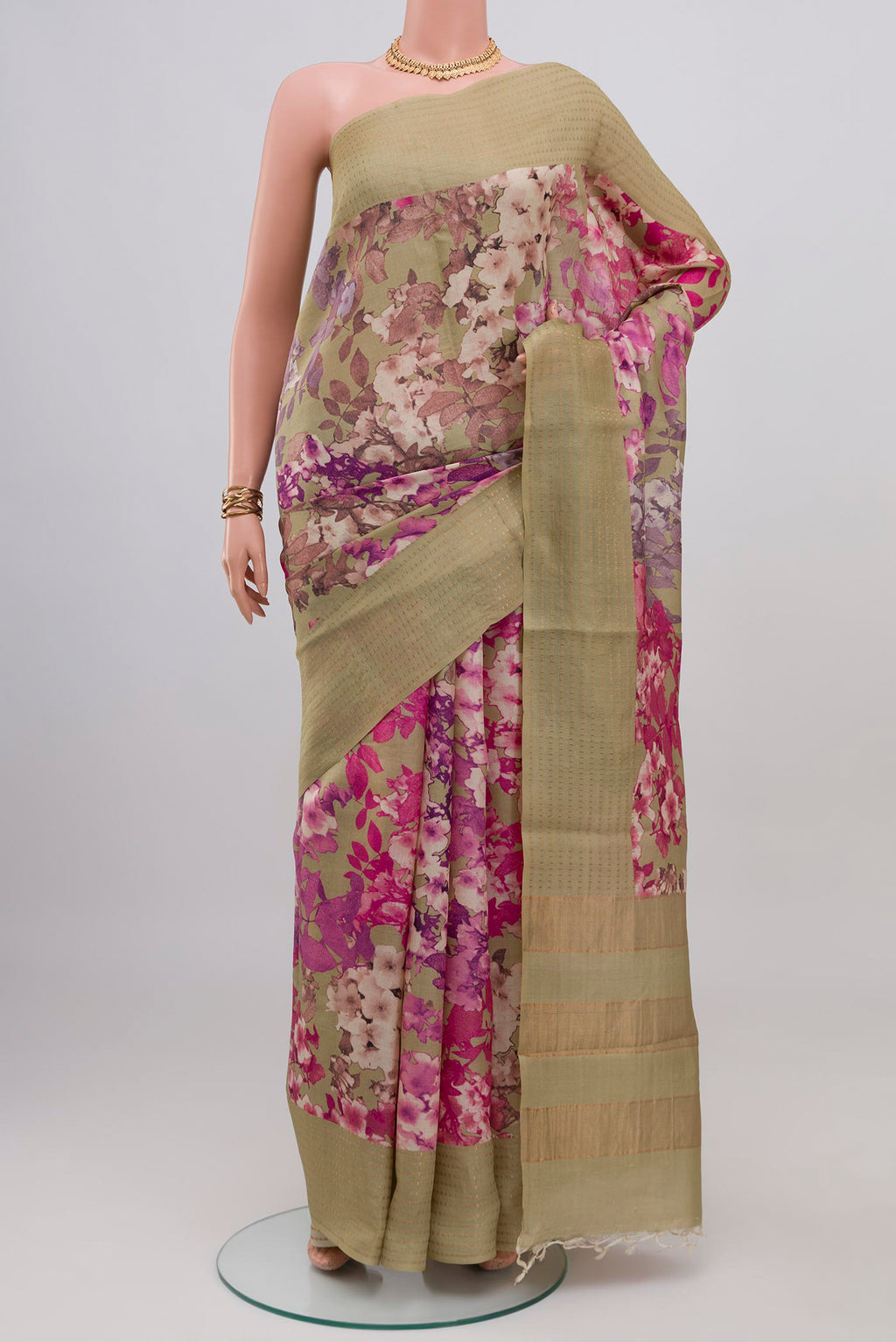 Beige Tussar Silk Saree with Floral Print on the body and Fancy Border.  displayed on a mannequin