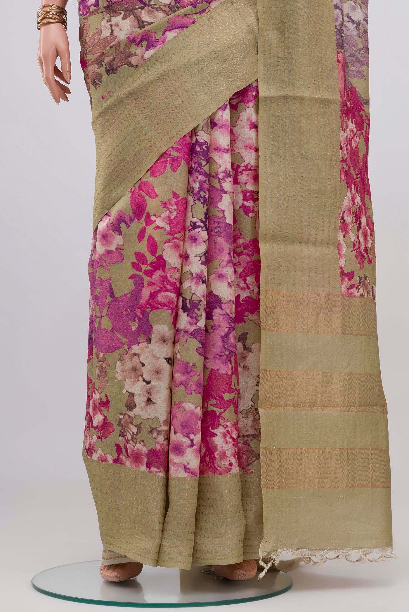 Pleats and pallu of Beige Tussar Silk Saree with Floral Print on the body and Fancy Border. 