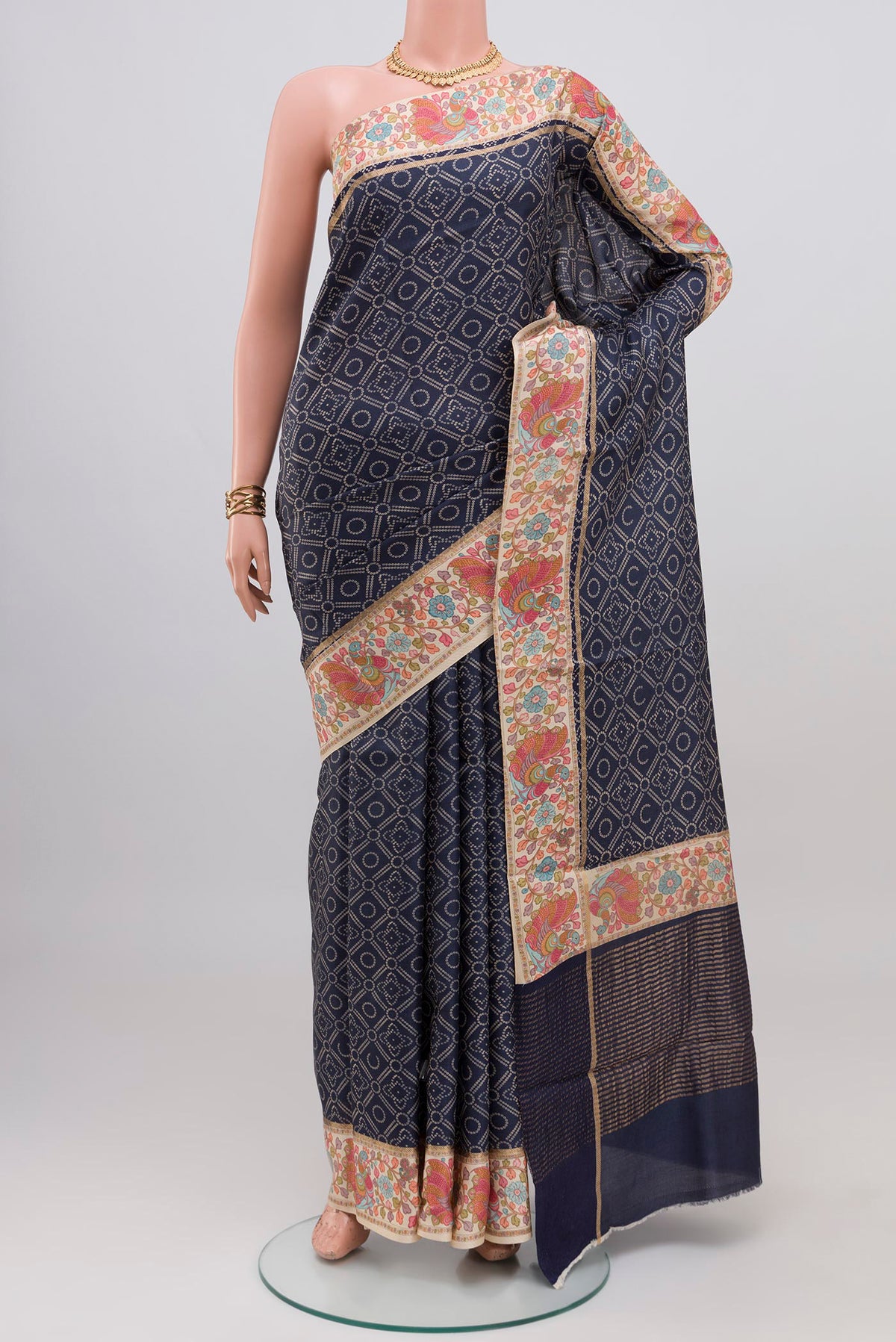 Blue Tussar Silk Saree with Printed design on the body and Printed Border.  displayed on a mannequin
