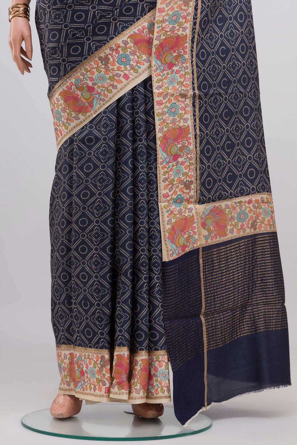 Pleats and pallu of Blue Tussar Silk Saree with Printed design on the body and Printed Border. 