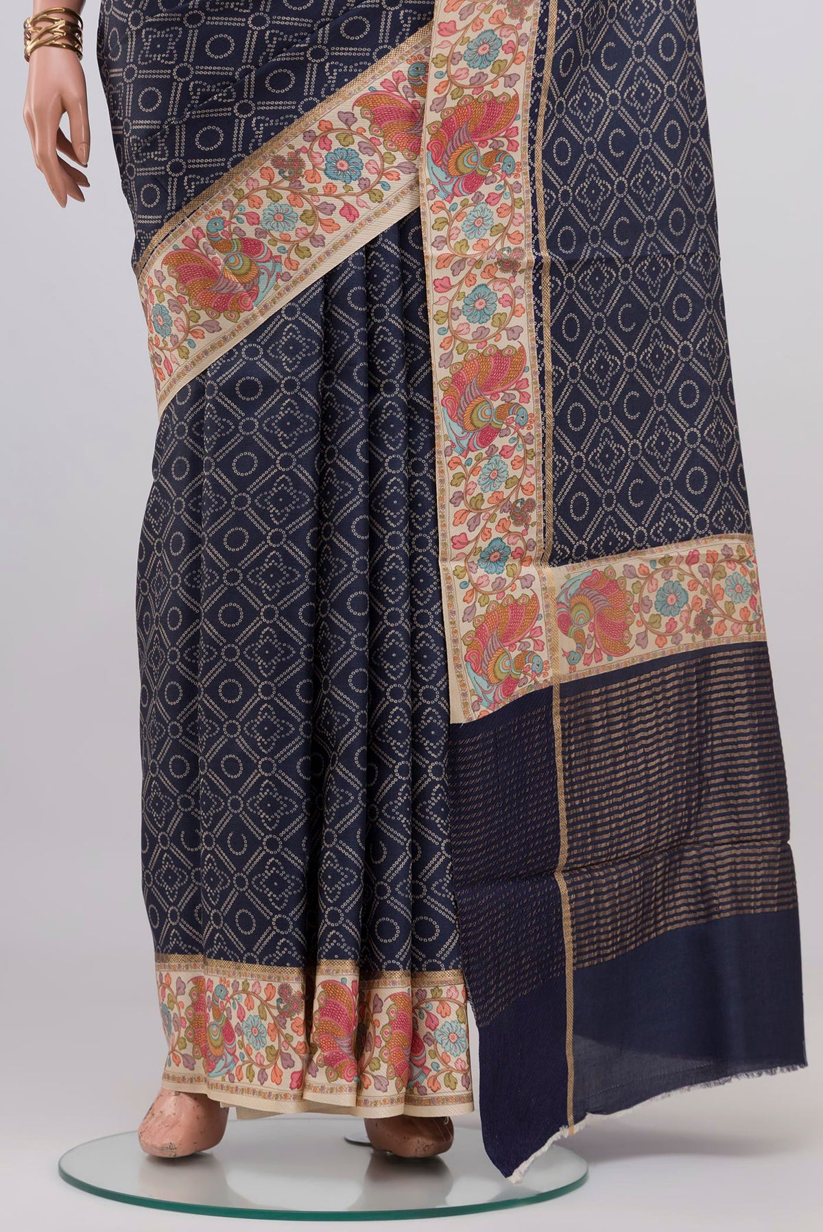 Pleats and pallu of Blue Tussar Silk Saree with Printed design on the body and Printed Border. 
