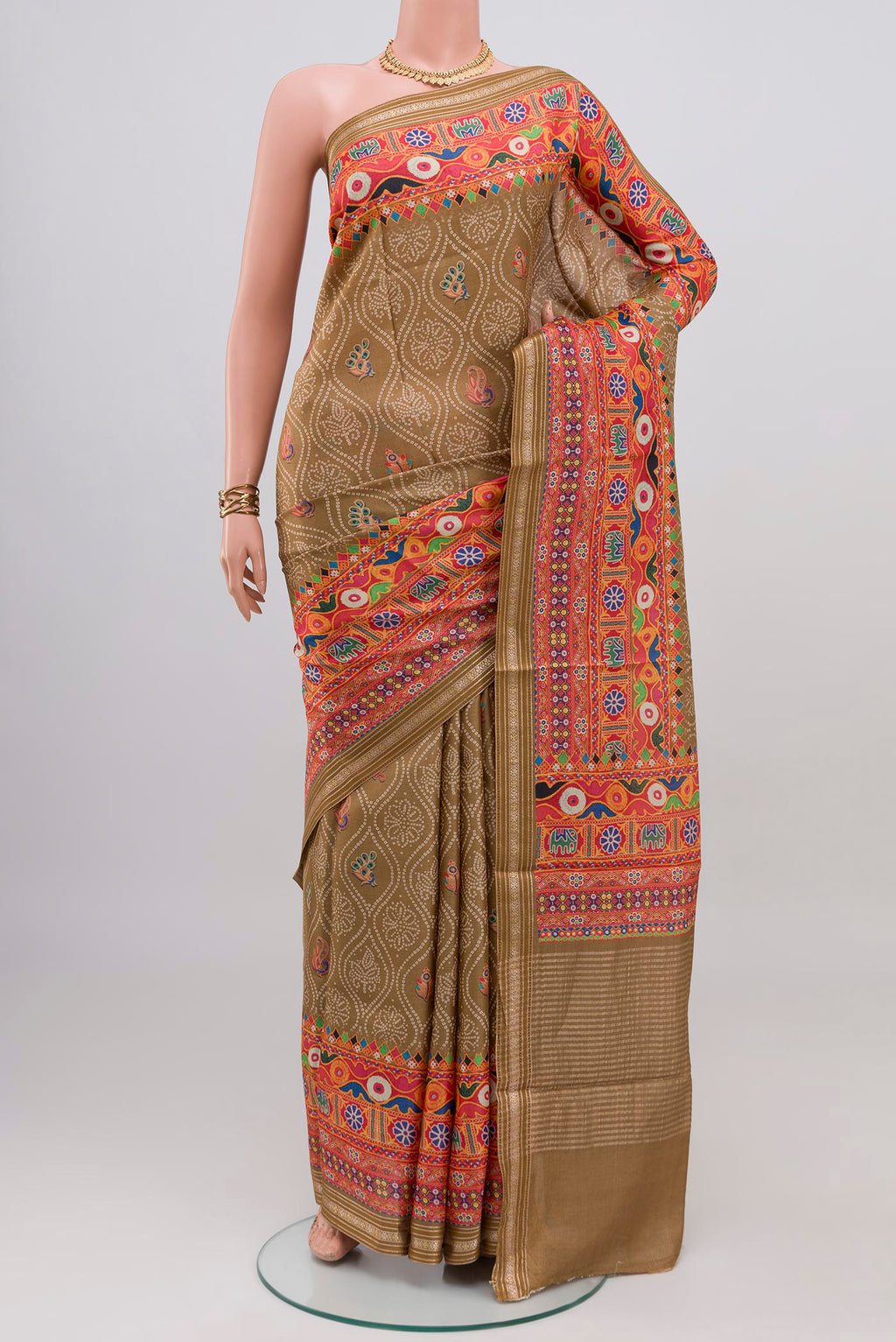 Beige Tussar Silk Saree with Printed design on the body and Printed Border.  displayed on a mannequin