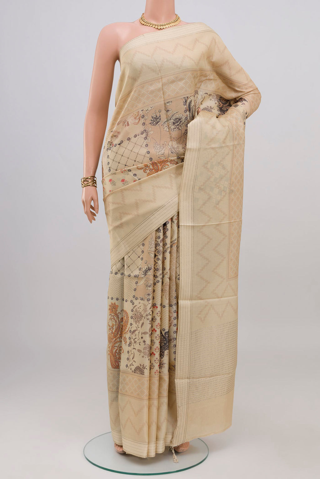 Cream Tussar Silk Saree with Printed design on the body and Thin Zari Line.  displayed on a mannequin