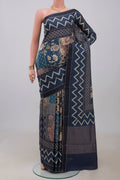 Blue Tussar Saree with Printed design on the body and Printed Border.  displayed on a mannequin