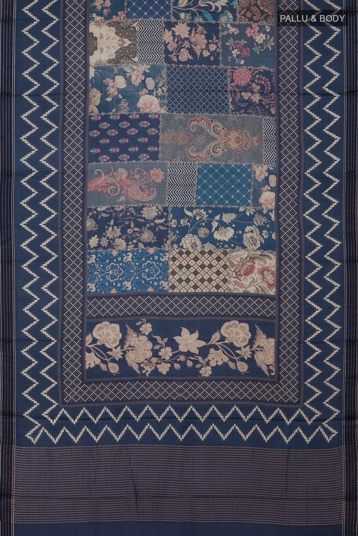 Flat view of Blue Tussar Saree with Printed design on the body and Printed Border. 