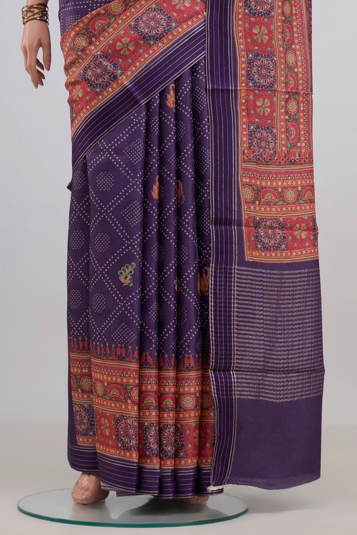 Pleats and pallu of Pure Silk Purple Tussar Saree with Bandhani Print on the body and Printed Border. 