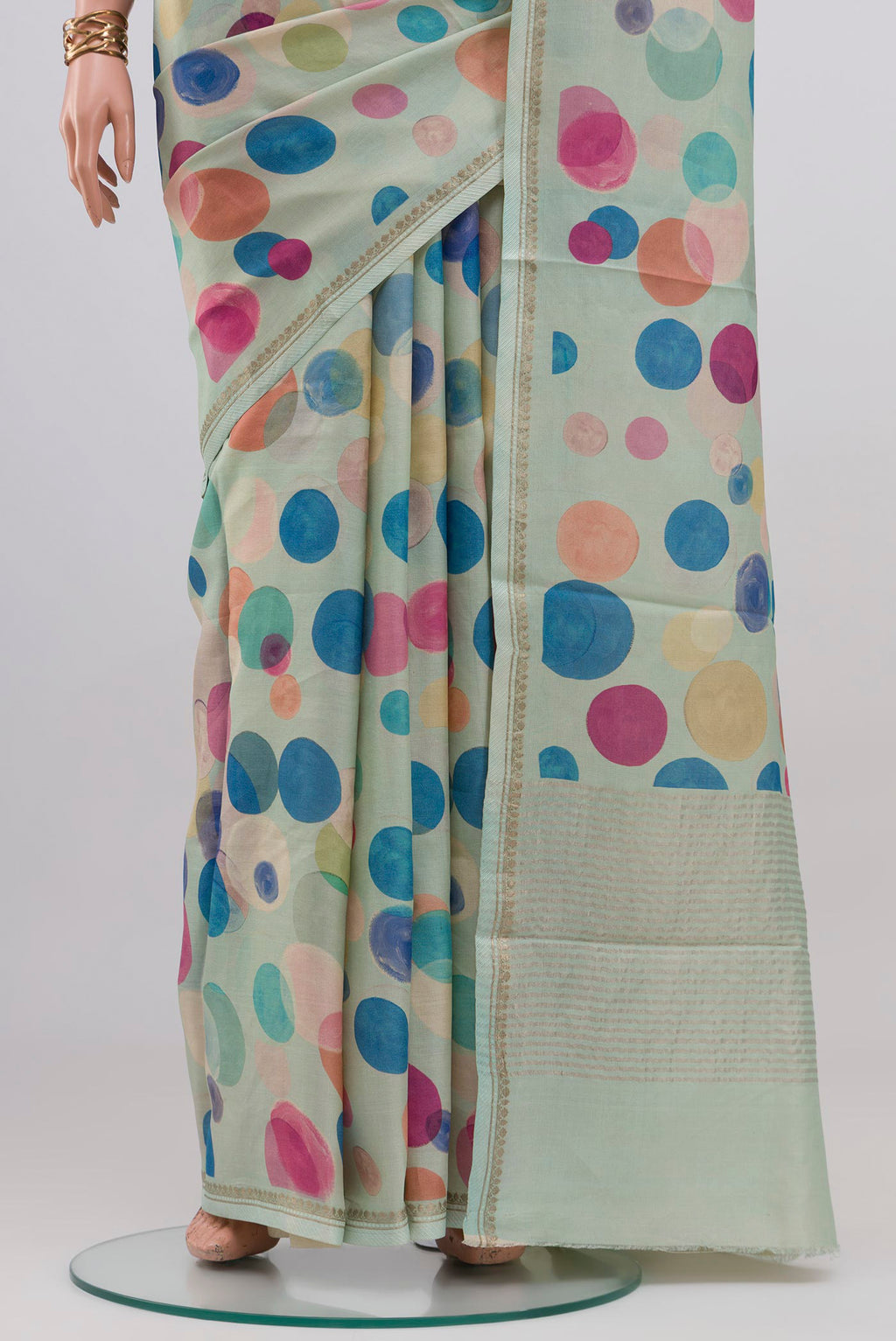 Pleats and pallu of Light Blue Tussar Silk Saree with Printed design on the body and Thin Zari Line. 
