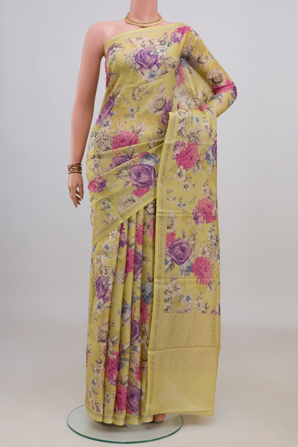Yellow Tussar Saree with Floral Print on the body and Thin Zari Line.  displayed on a mannequin