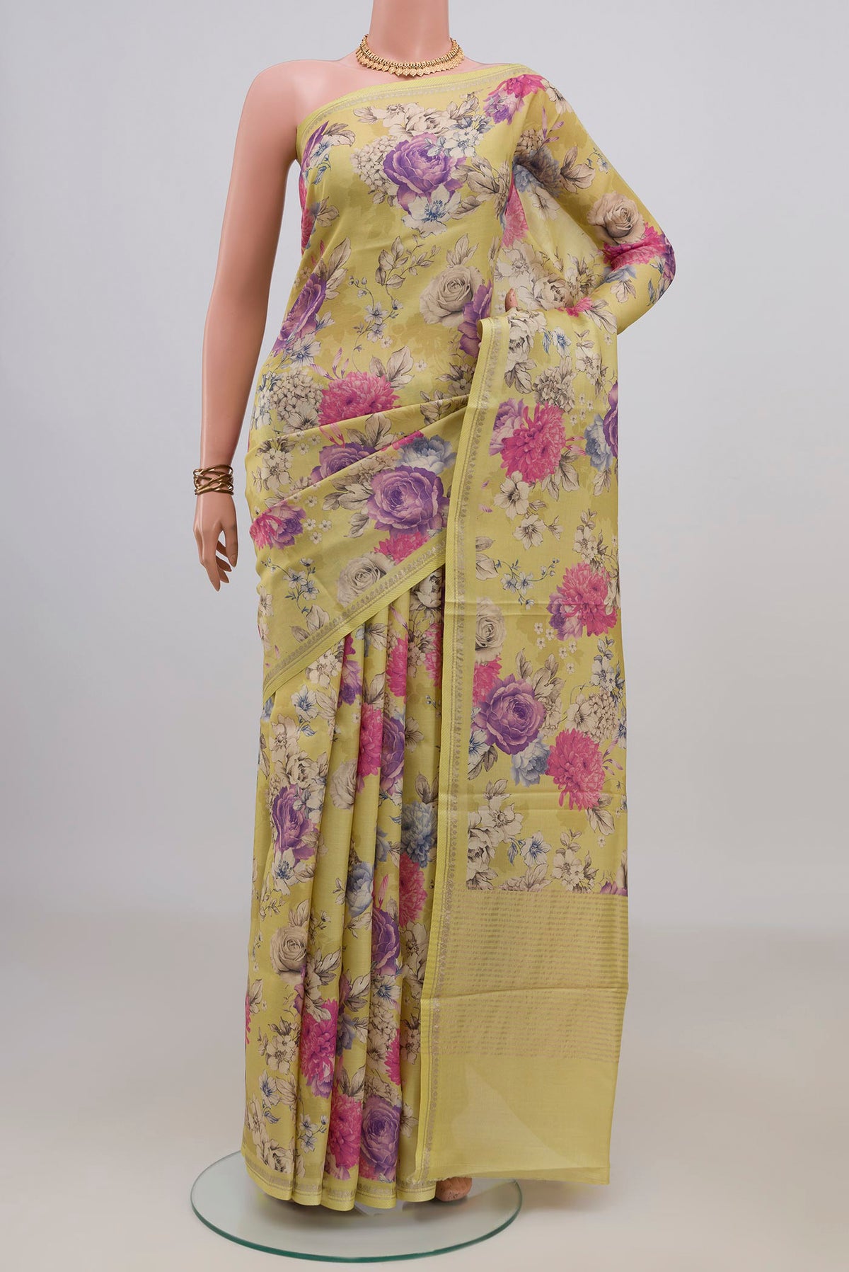 Yellow Tussar Saree with Floral Print on the body and Thin Zari Line.  displayed on a mannequin