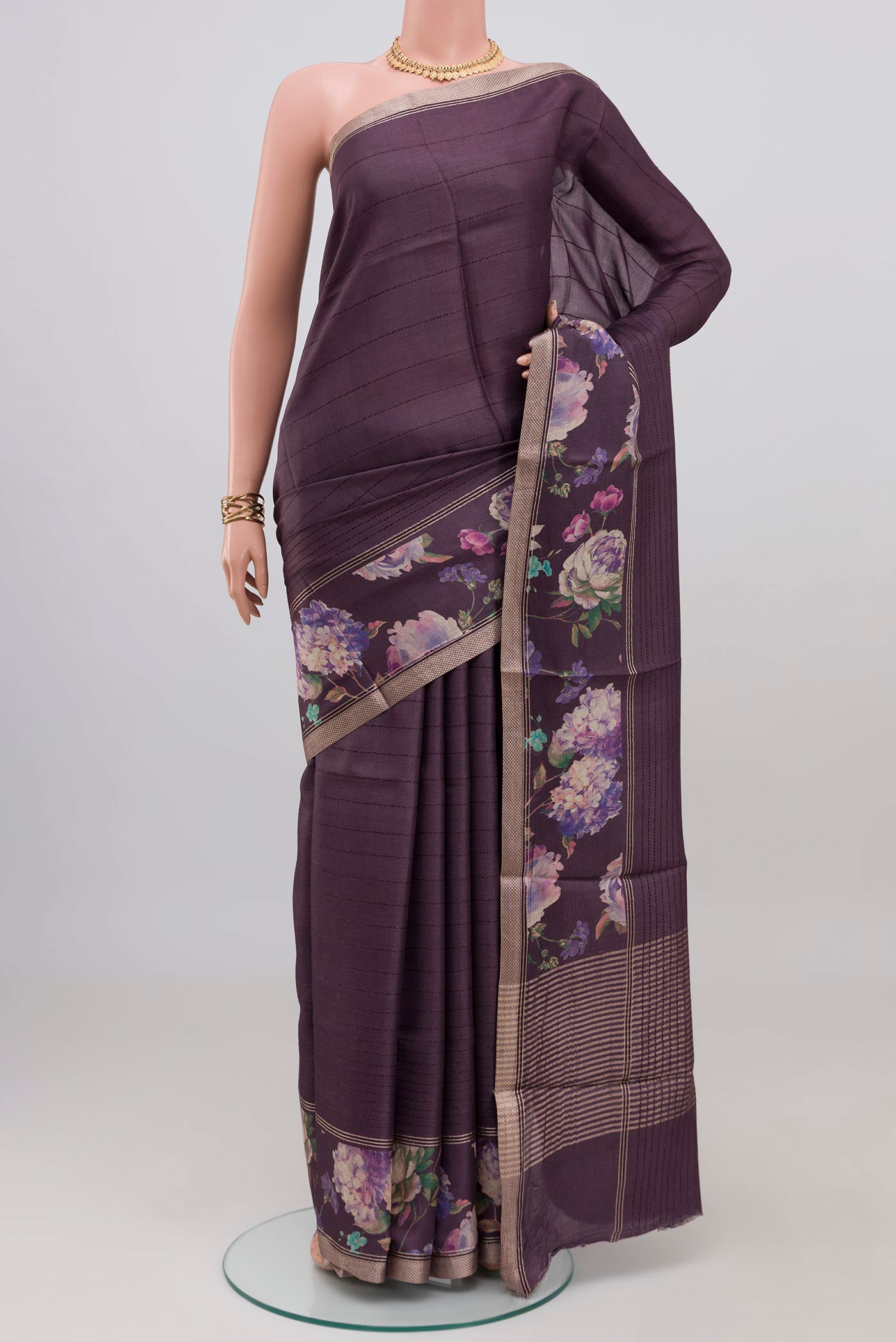 Purple Tussar Silk Saree with Stripes on the body and Printed Border.  displayed on a mannequin