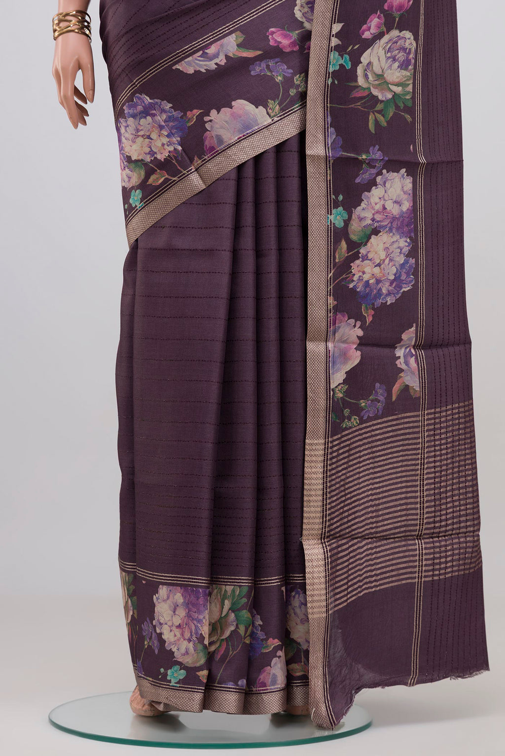 Pleats and pallu of Purple Tussar Silk Saree with Stripes on the body and Printed Border. 