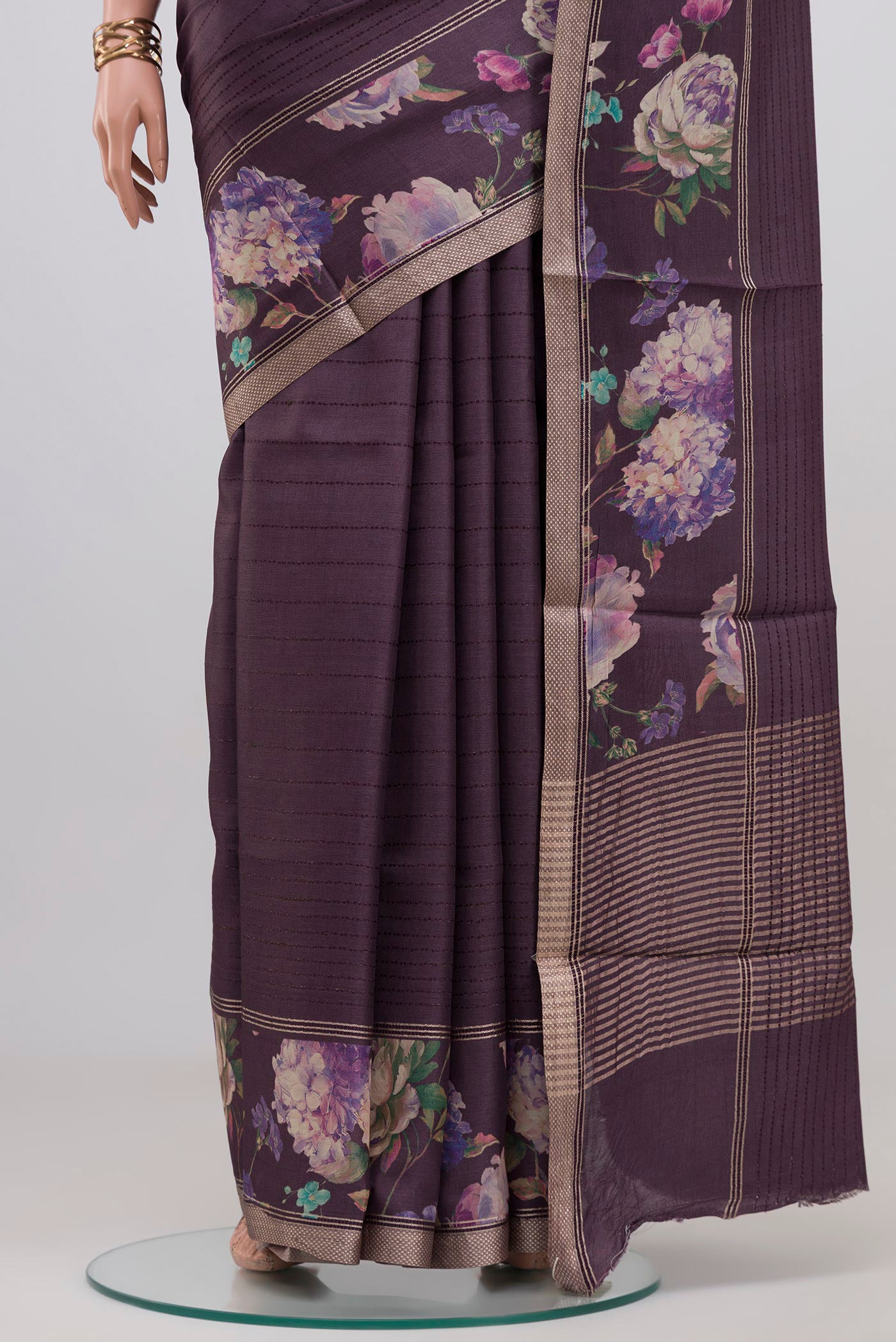 Pleats and pallu of Purple Tussar Silk Saree with Stripes on the body and Printed Border. 