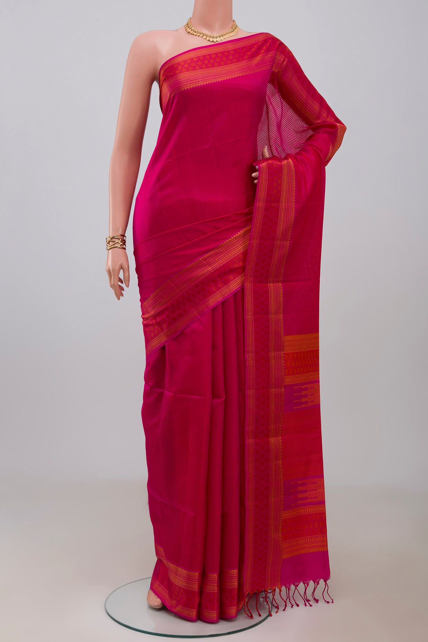 Pink Soft Silk Saree with Plain Body and Thread Border.  displayed on a mannequin