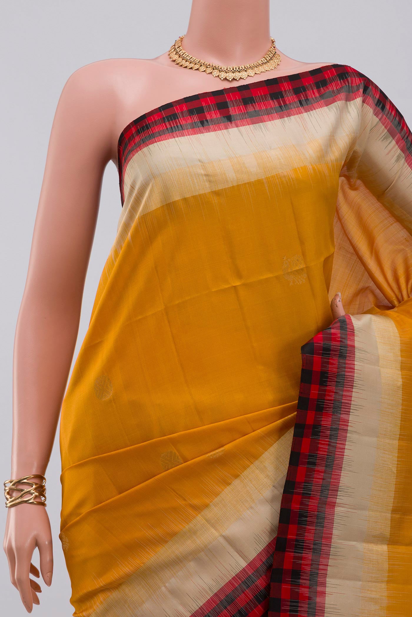 Border image of Yellow Soft Silk Saree with Zari Butta on the body and Fancy Border. 