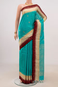 Blue Soft Silk Saree with Zari Butta on the body and Thin Zari Line.  displayed on a mannequin