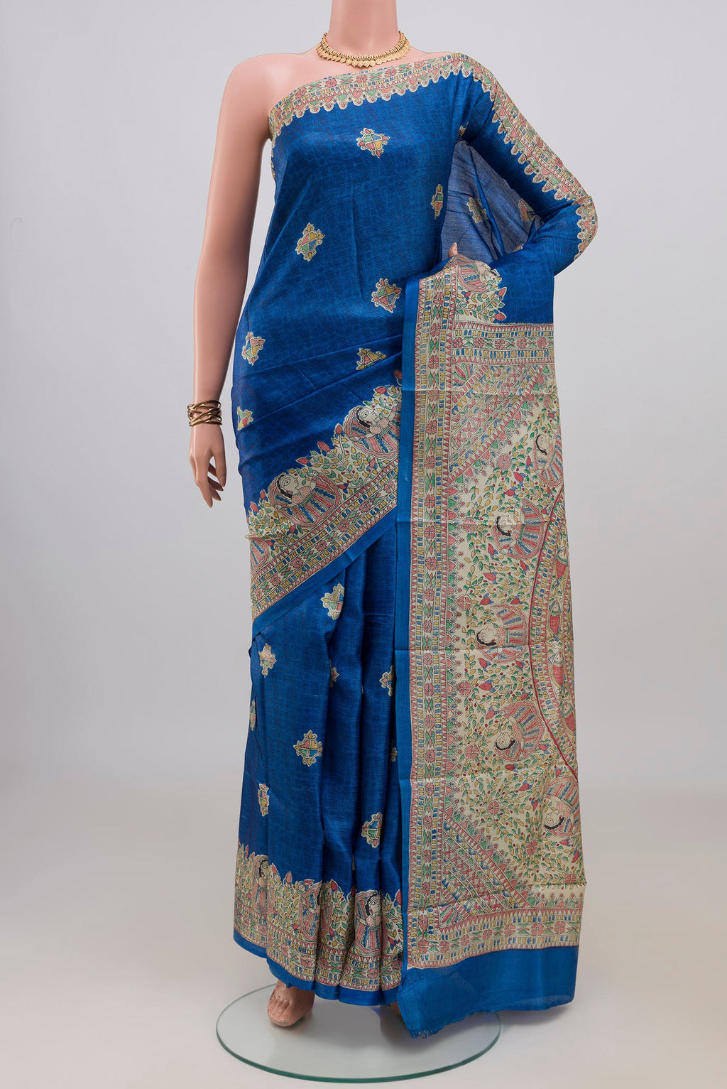 Blue Tussar Saree with Printed design on the body and Printed Border.  displayed on a mannequin