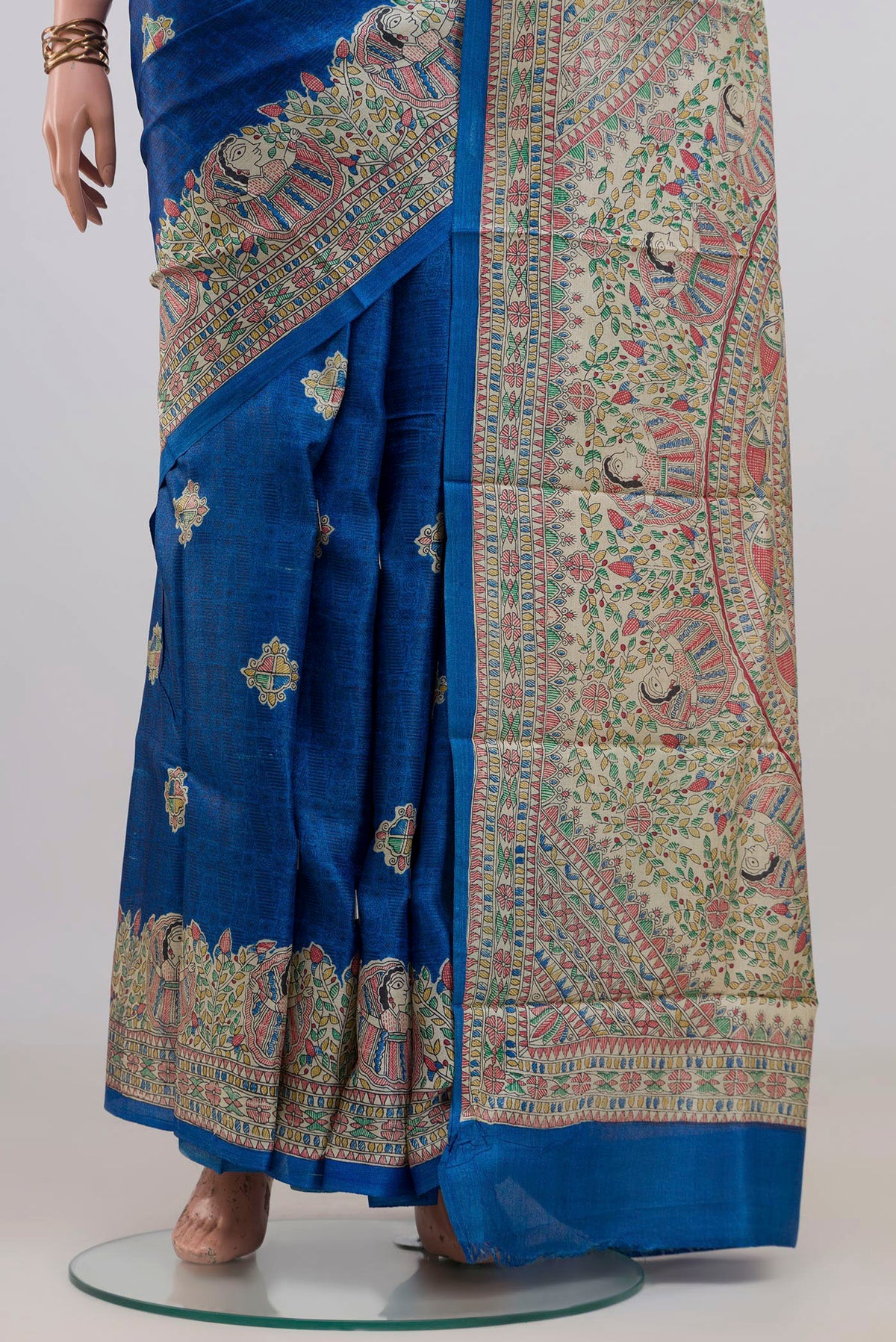 Pleats and pallu of Blue Tussar Saree with Printed design on the body and Printed Border. 