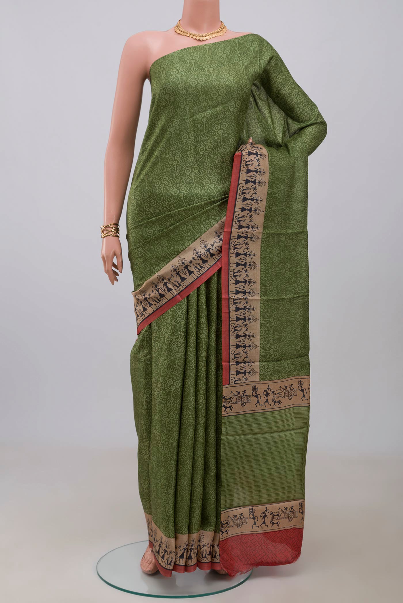 Green Printed Silk Saree with Printed design on the body and Printed Border.  displayed on a mannequin