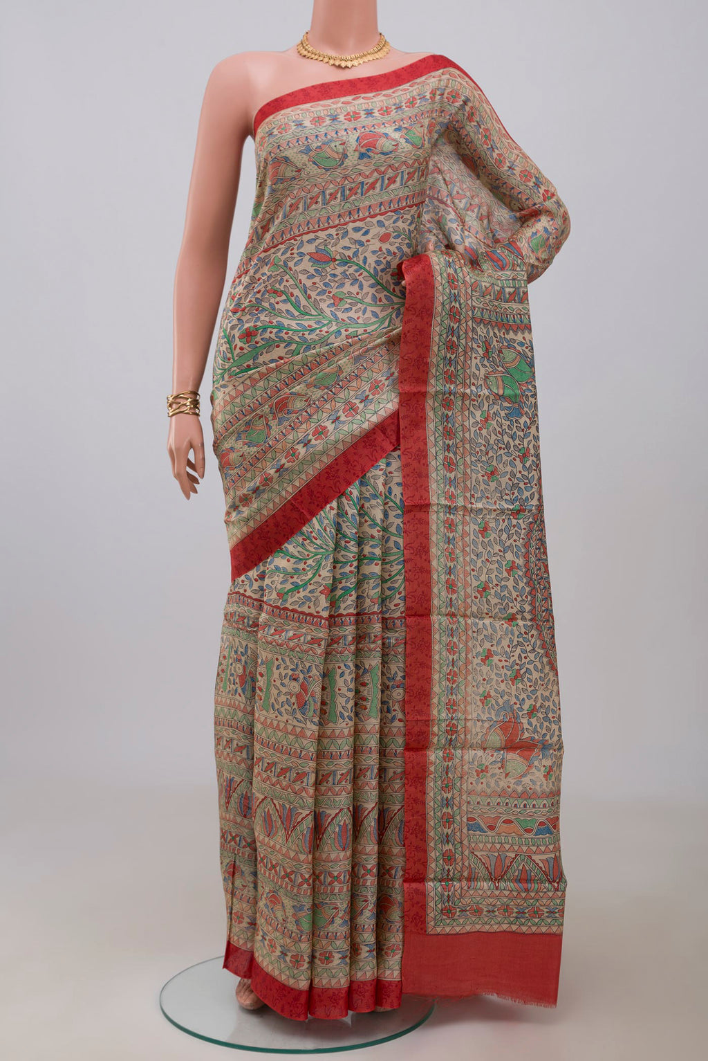 Cream Printed Silk Saree with Printed design on the body and Printed Border.  displayed on a mannequin
