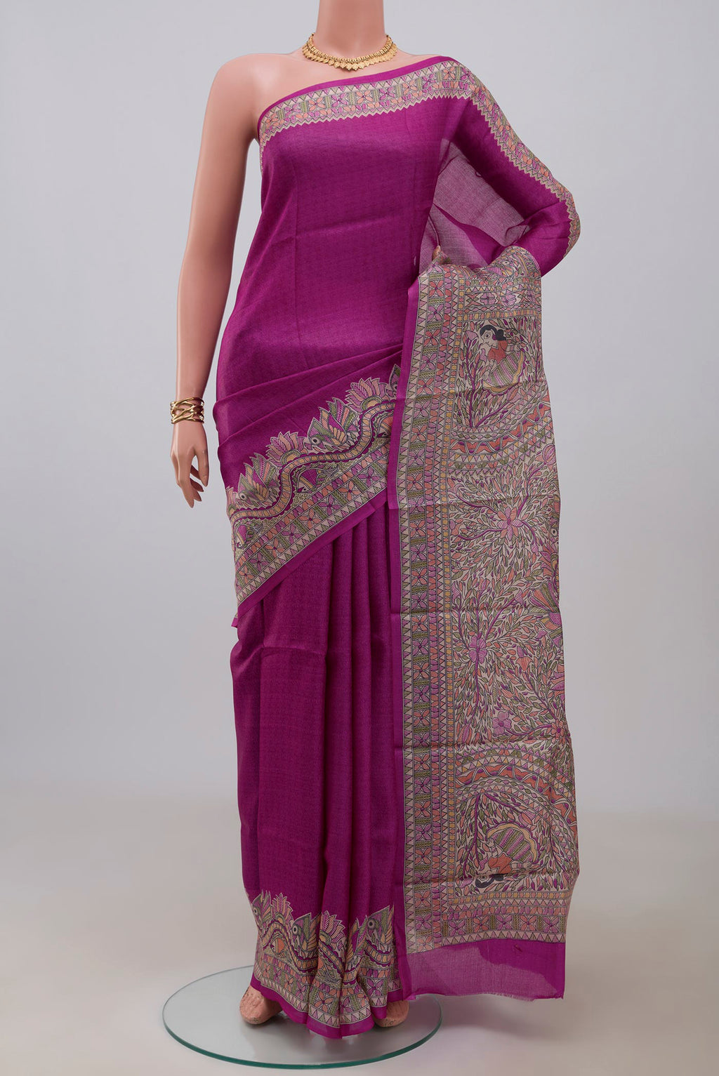 Pink Printed Silk Saree with Printed design on the body and Printed Border.  displayed on a mannequin