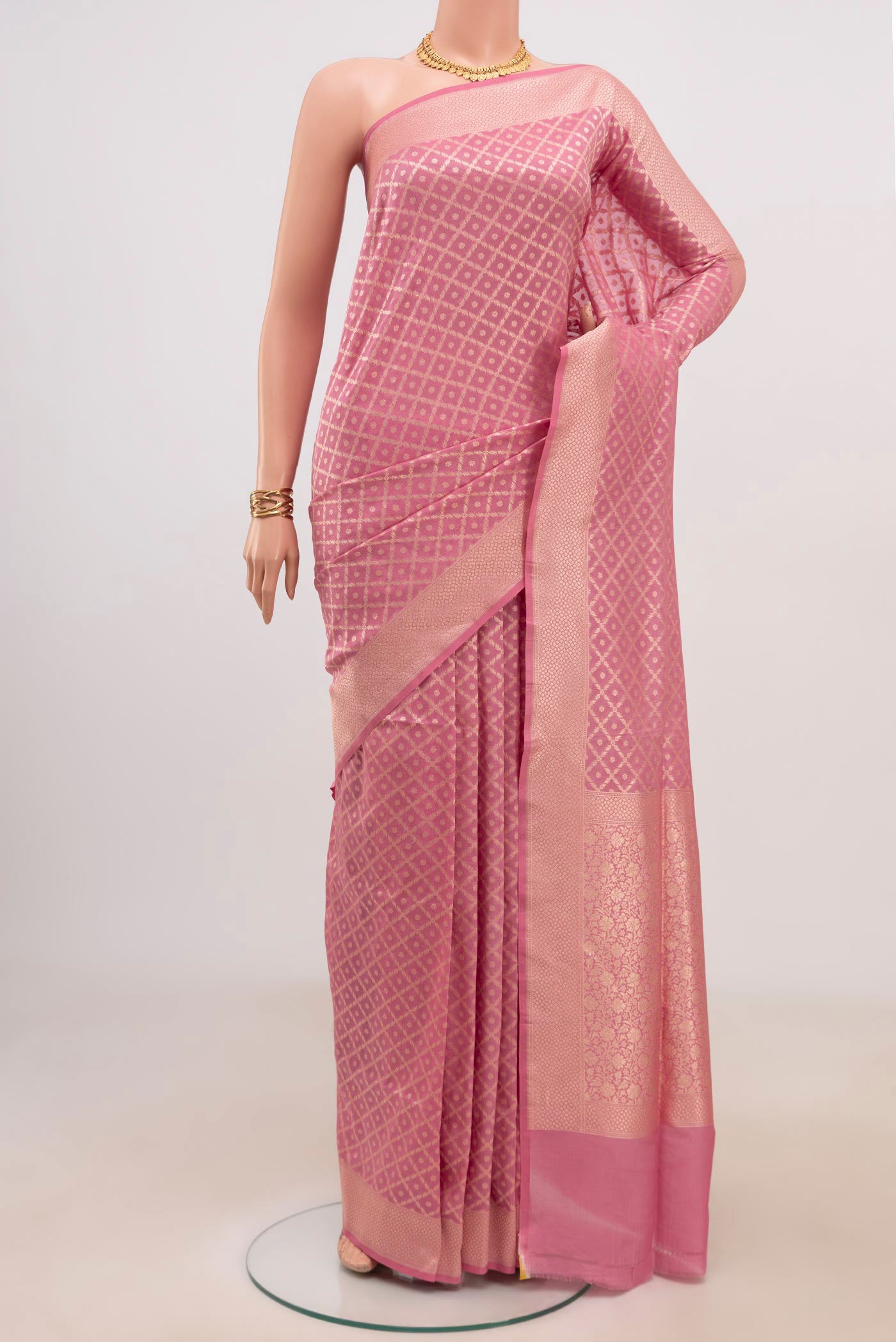 Pink Banarasi Saree with Fancy on the body and Fancy Border.  displayed on a mannequin