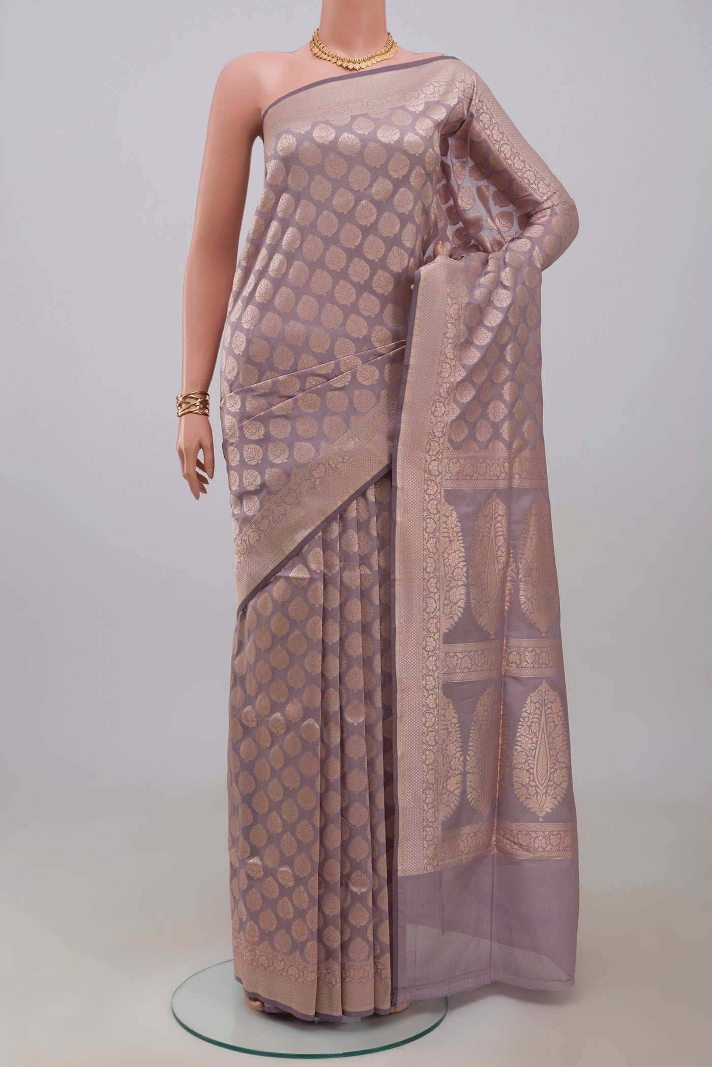 Lavender Banarasi Silk Saree with Zari Brocade on the body and Zari Border.  displayed on a mannequin