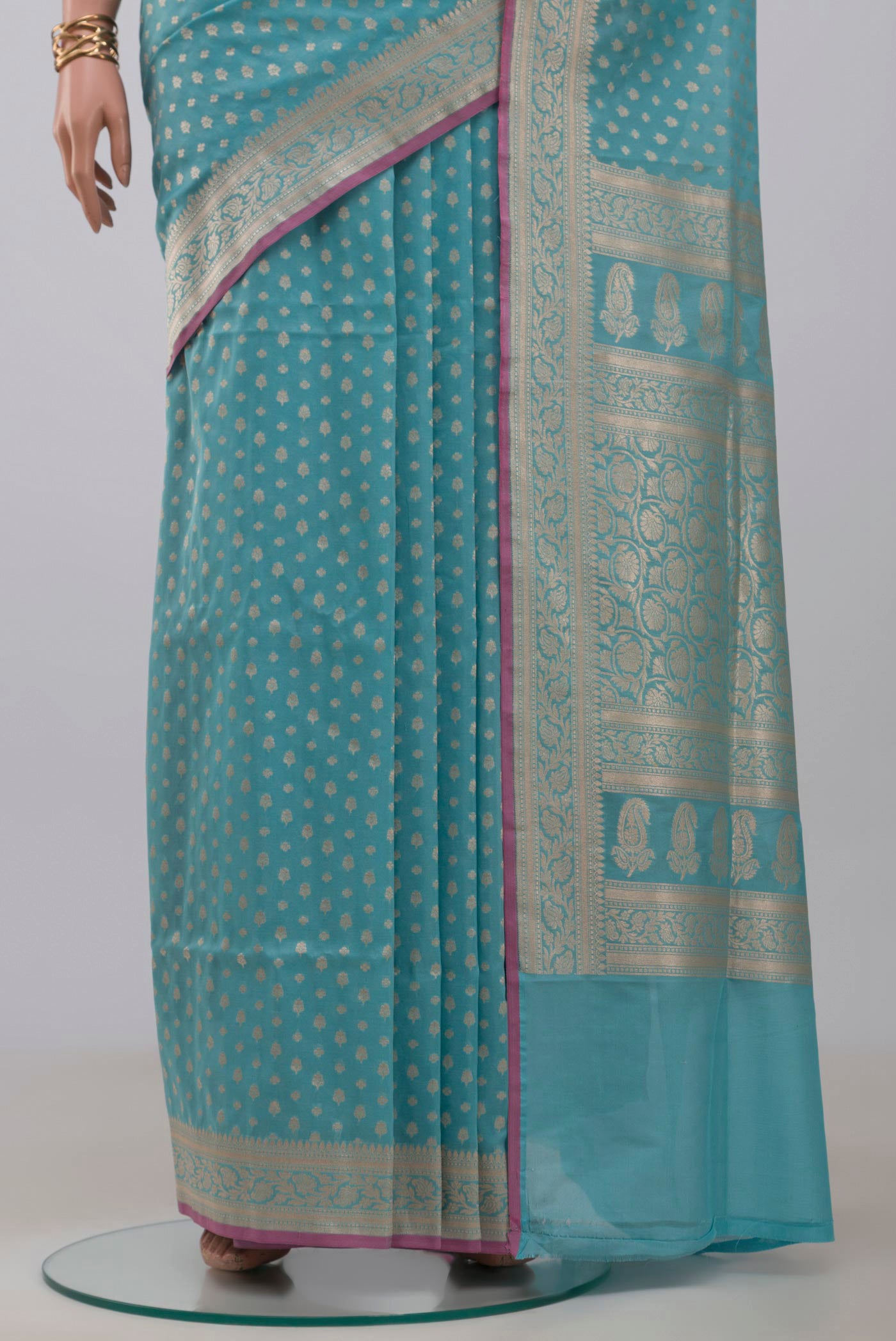 Pleats and pallu of Light Blue Banarasi Silk Saree with Zari Butta on the body and Zari Border. 
