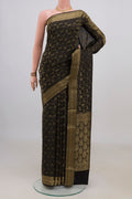 Black Mysore Crepe Saree with Zari Brocade on the body and Fancy Border.  displayed on a mannequin