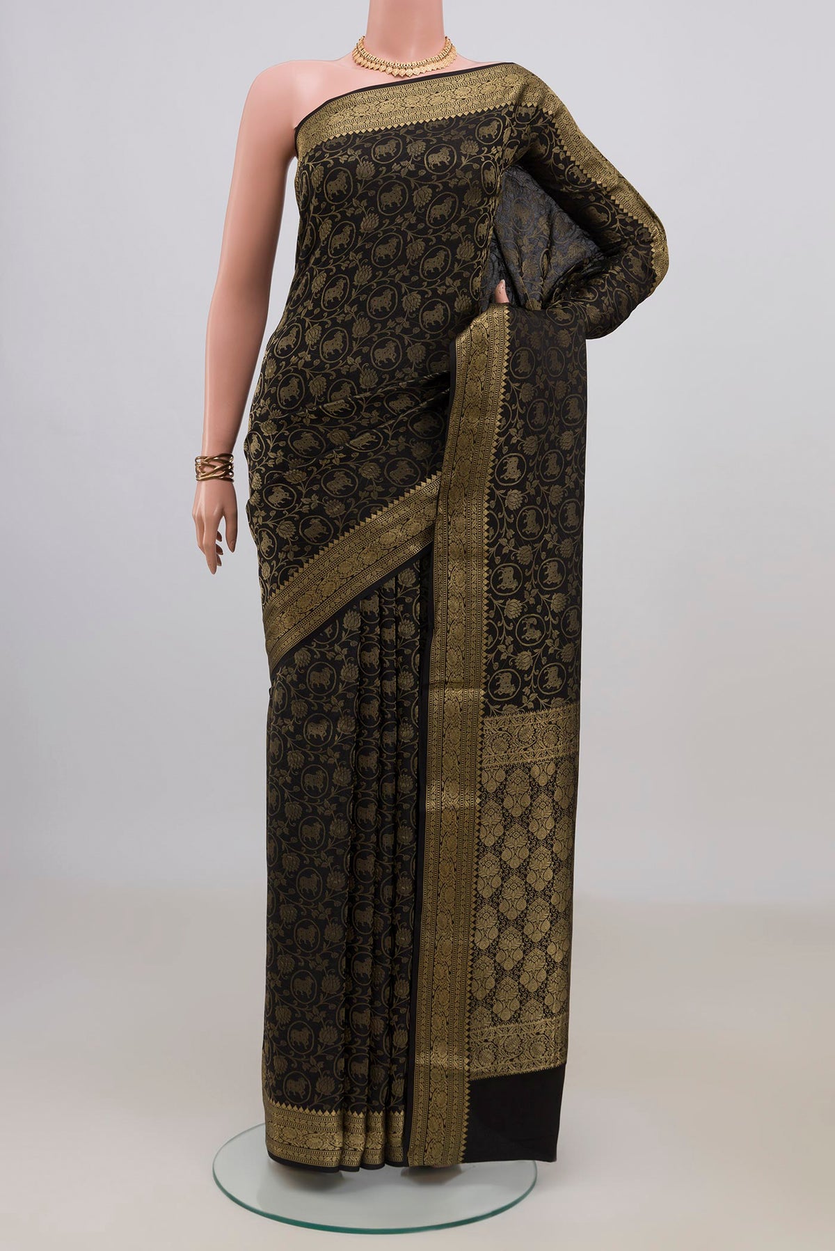 Black Mysore Crepe Saree with Zari Brocade on the body and Fancy Border.  displayed on a mannequin