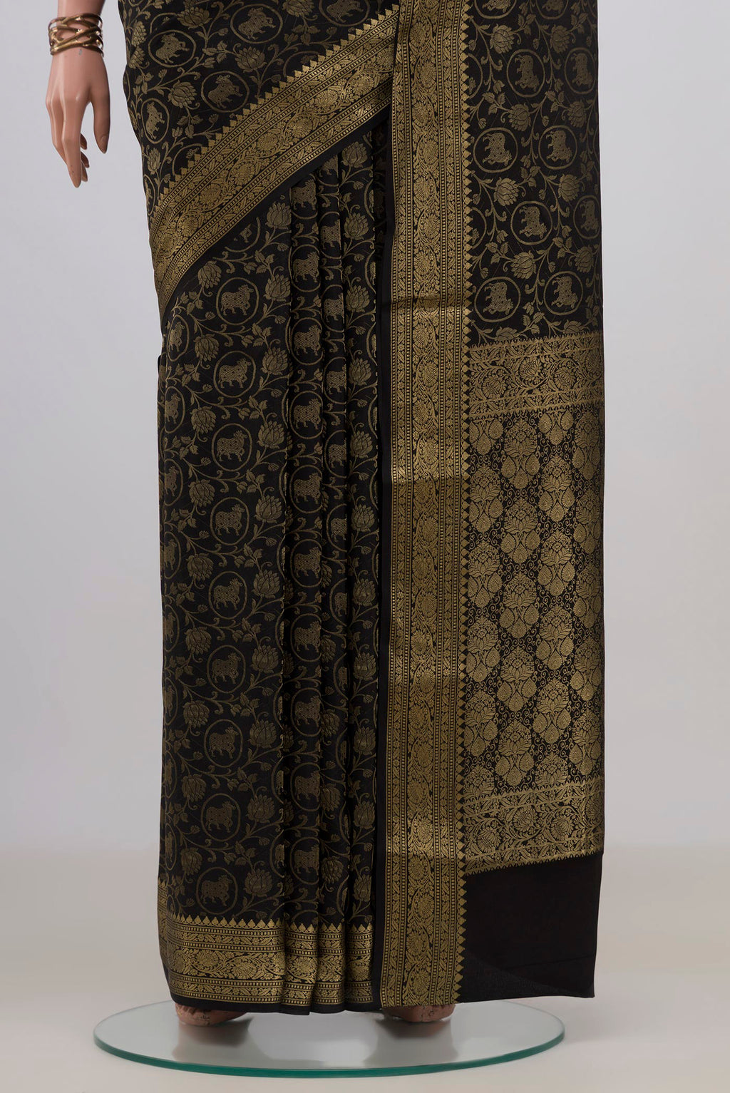 Pleats and pallu of Black Mysore Crepe Saree with Zari Brocade on the body and Fancy Border. 