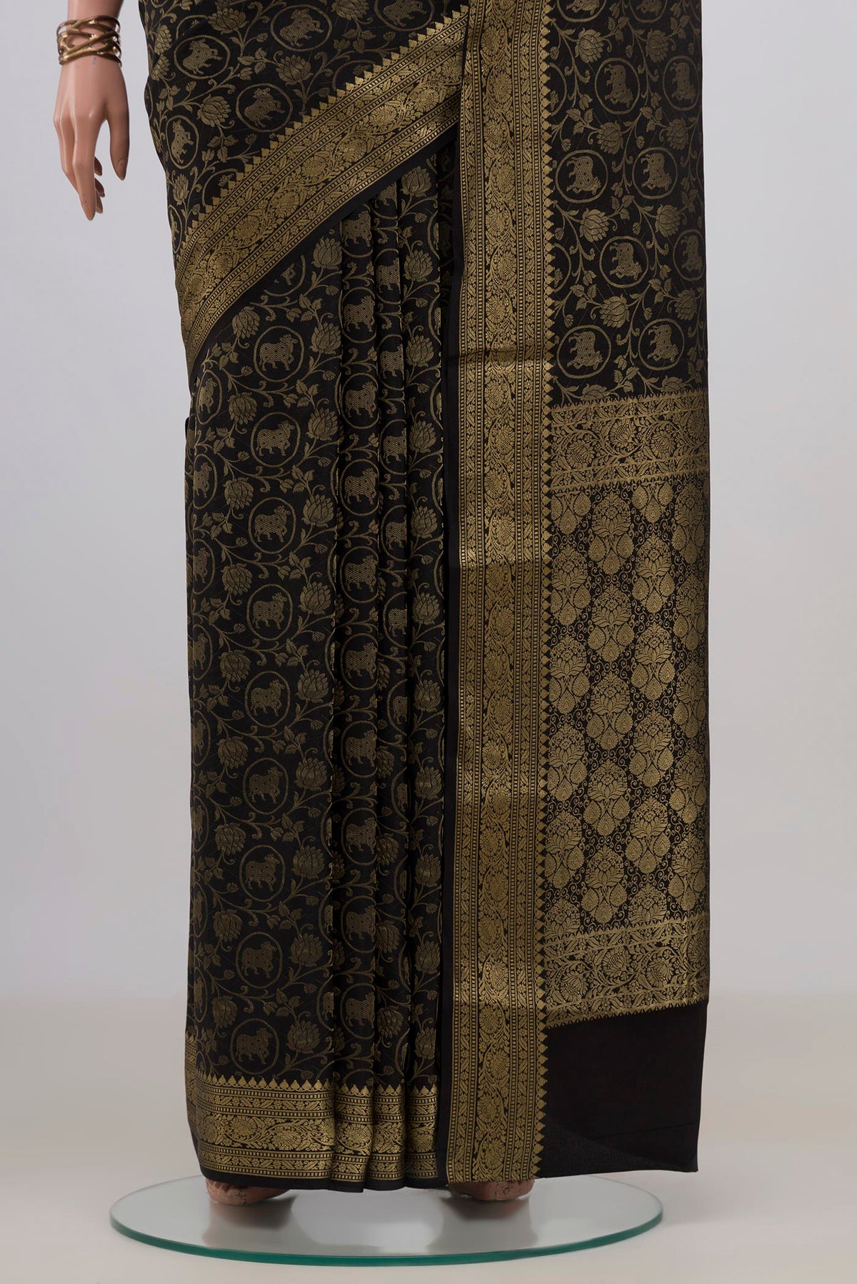 Pleats and pallu of Black Mysore Crepe Saree with Zari Brocade on the body and Fancy Border. 