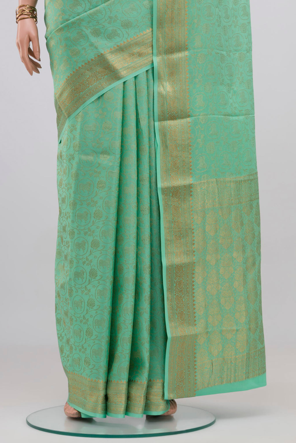 Pleats and pallu of Sea Green Mysore Crepe Saree with Zari Brocade on the body and Zari Border. 