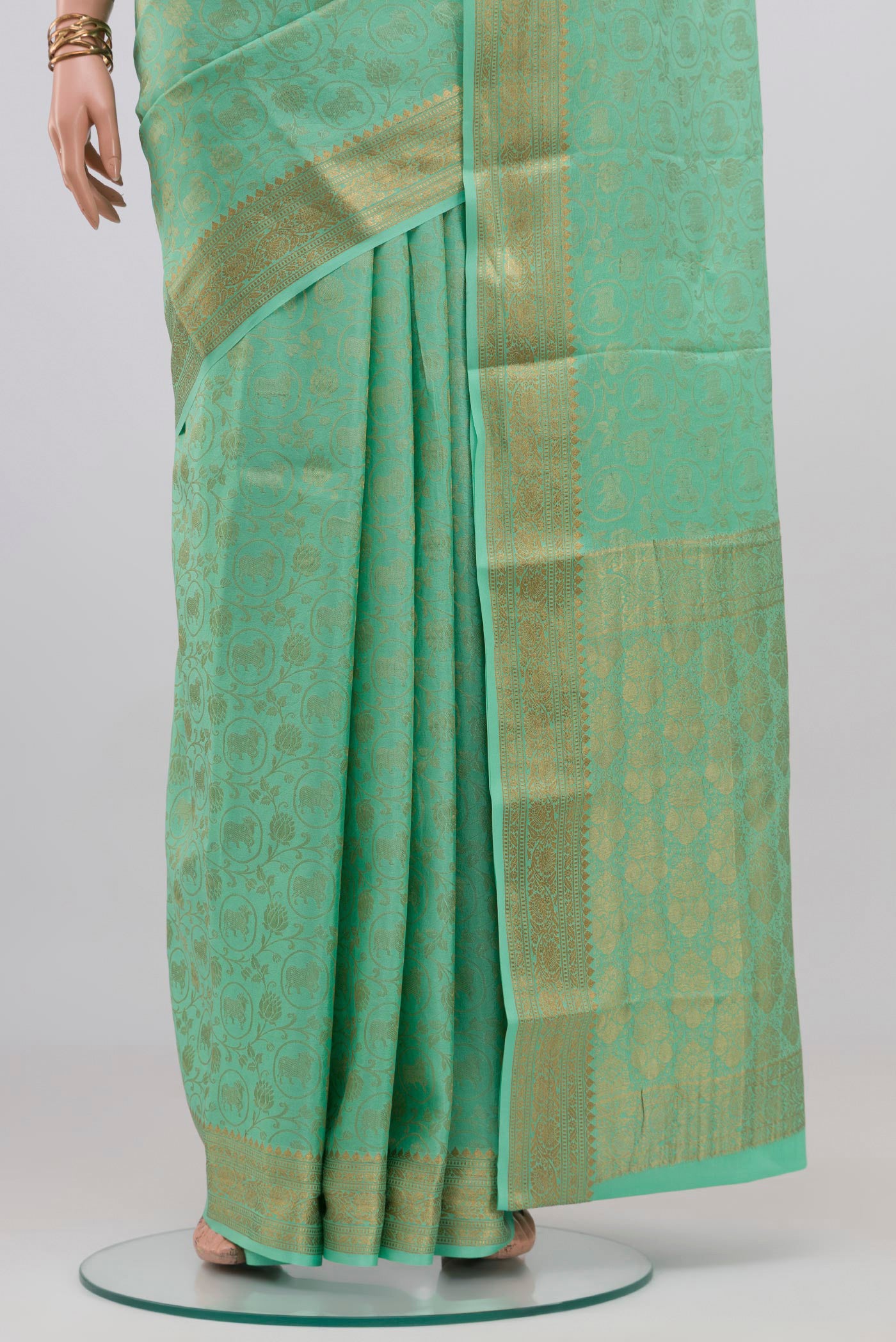 Pleats and pallu of Sea Green Mysore Crepe Saree with Zari Brocade on the body and Zari Border. 