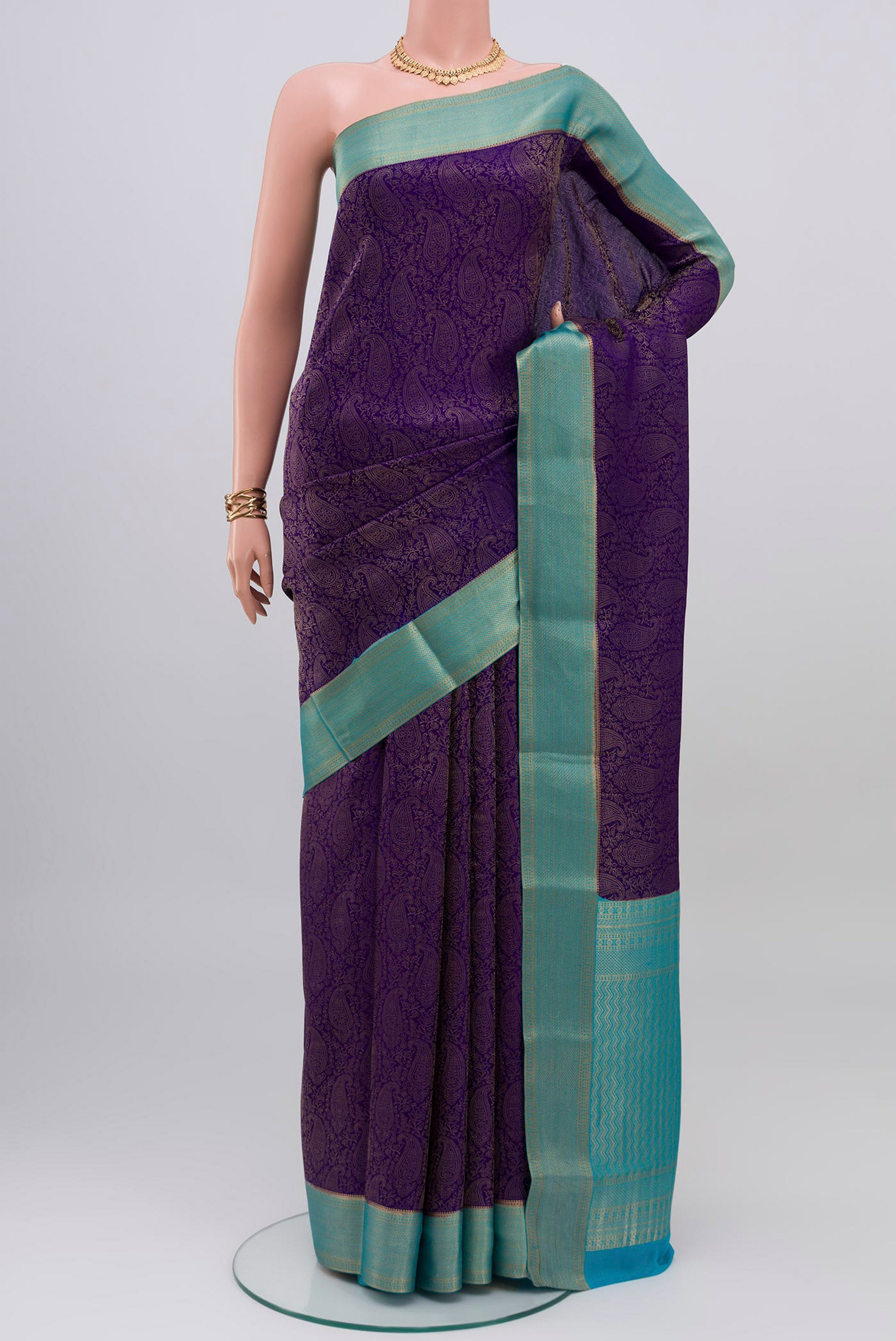 Navy Blue Mysore Crepe Saree with Zari Brocade on the body and Zari Border.  displayed on a mannequin